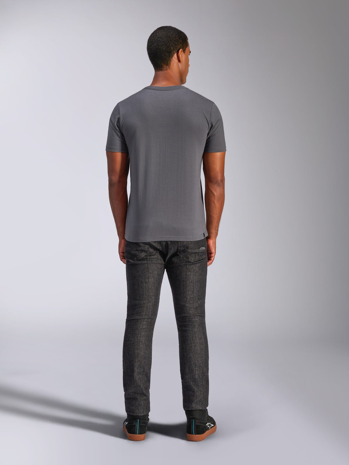 Alpinestars Always 2.0 CSF Tee, Short Sleeve T-Shirt, Charcoal Gray, back view, worn with dark denim pants, casual motorsport-inspired streetwear