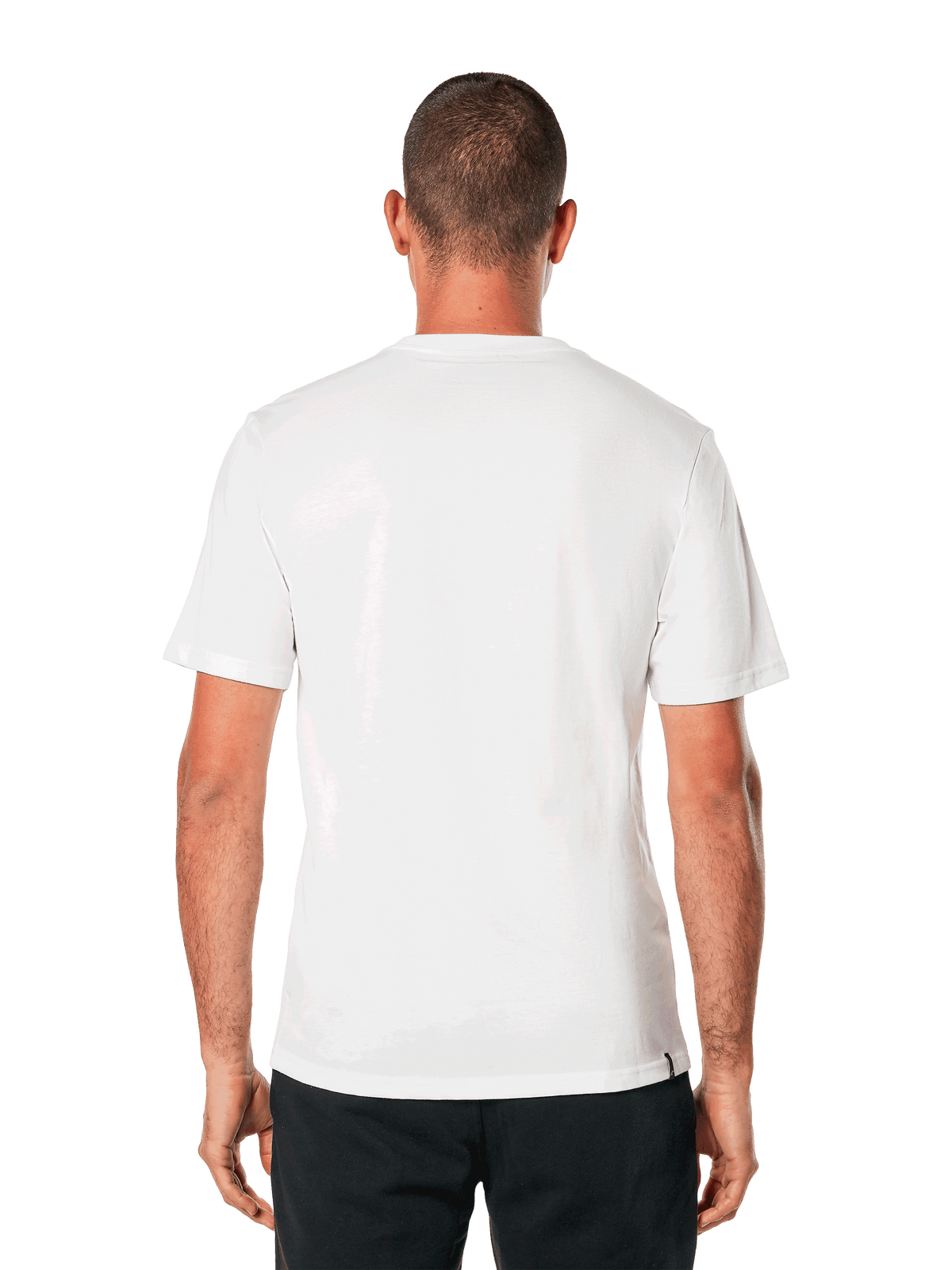Alpinestars MX Helmet CSF Tee, t-shirt à manches courtes, blanc, vue de dos, porté avec un pantalon noir, design décontracté inspiré des sports mécaniques