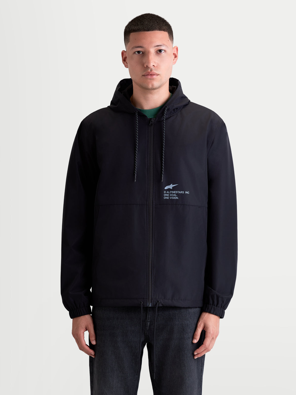 Alpinestars Veste Coupe-Vent Speeder Resolve, veste de sportswear légère pour homme, noire, construction coupe-vent avec capuche réglable, doublure en mesh et marquage 'One Goal. One Vision.' sur la poitrine