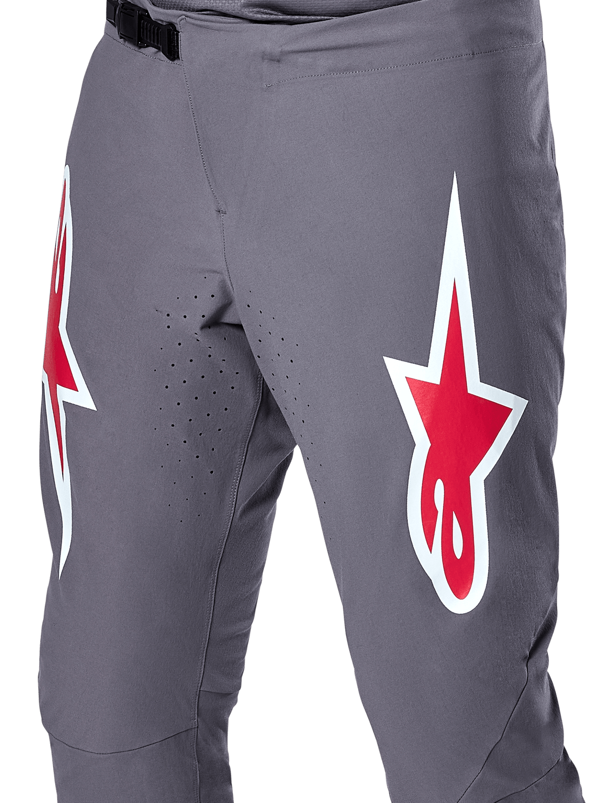 Alpinestars A-Supra Race Pants, MTB Racing Pants, Dark Gray with Red and White logos, close-up view showing laser-perforated ventilation on the inner thighs and a black ratchet waist closure.