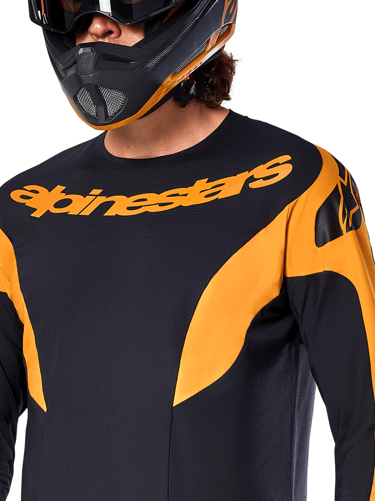 Alpinestars A-Supra Race Jersey - Long Sleeve, Black with orange graphic panels, large orange Alpinestars wordmark on chest, shown on a rider wearing a matching black and orange full-face helmet, performance MTB racing apparel
