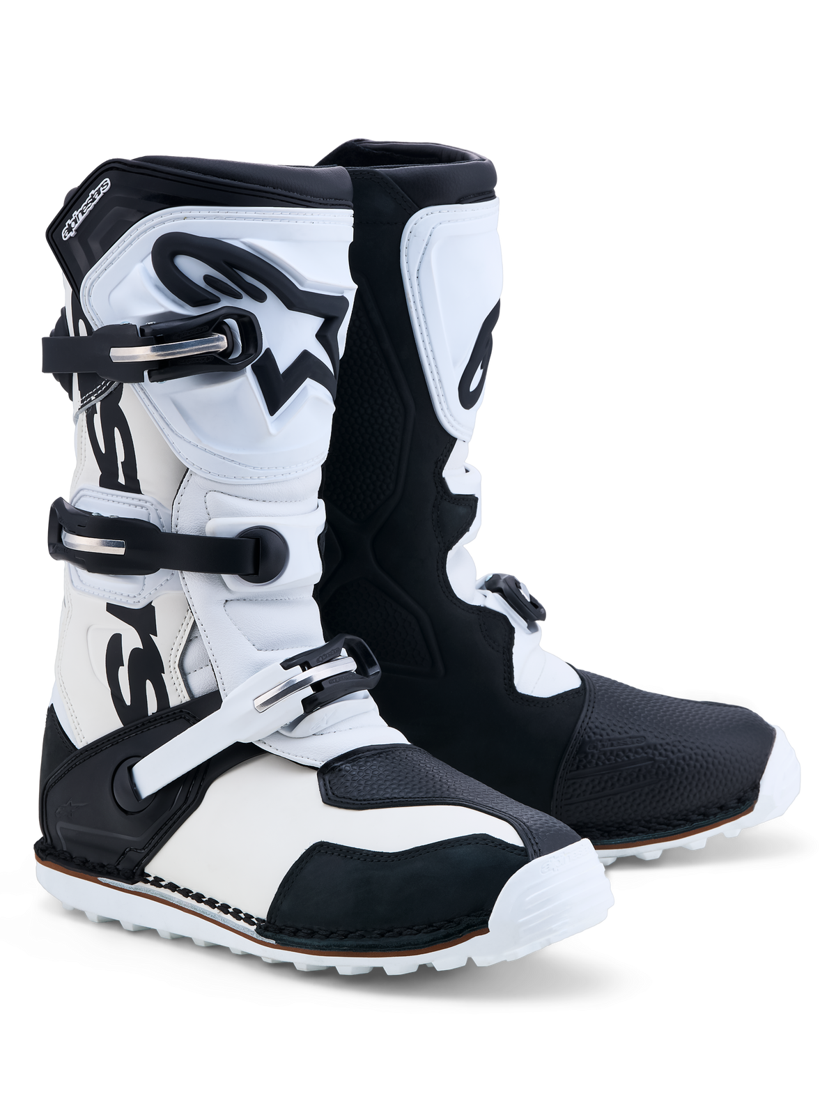 Alpinestars Tech-T Stiefel, Trial-Motorradstiefel in Schwarz und Weiß, aus Leder mit dreifachem Schnallenverschluss und TPU-Schienbeinplatte.