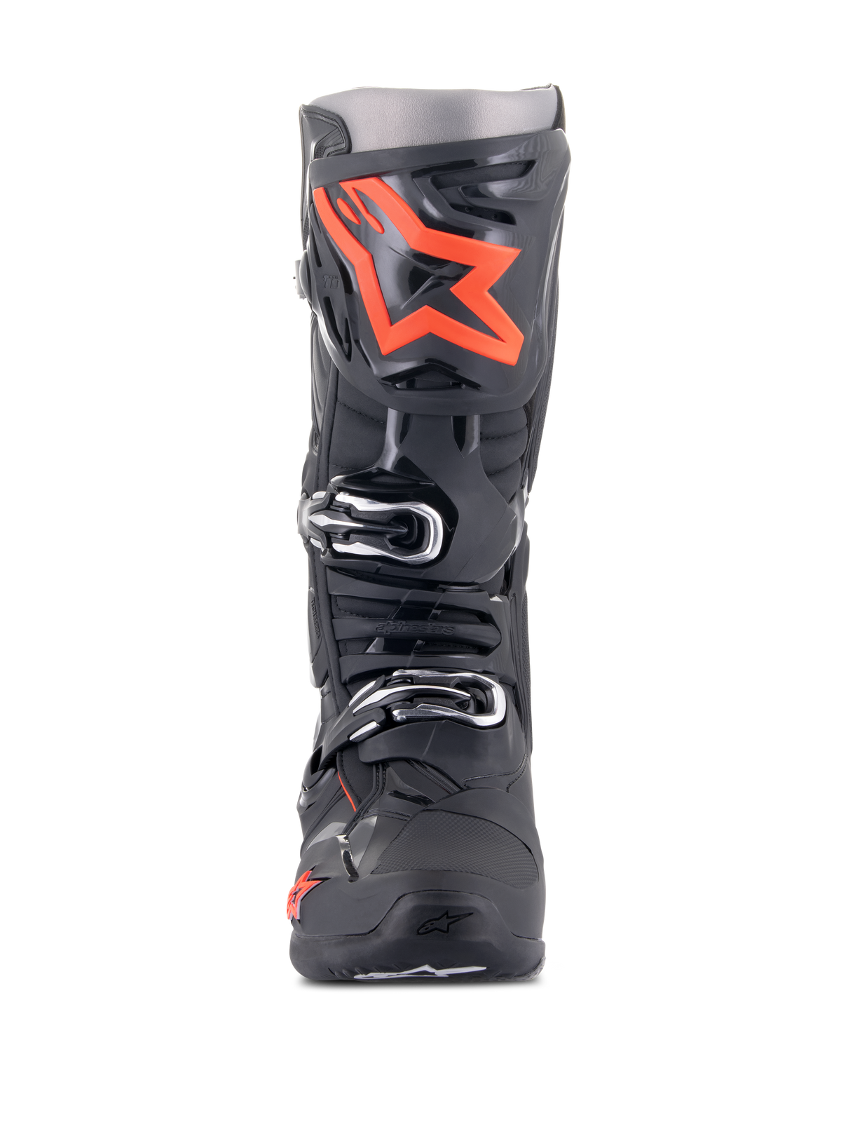 Alpinestars Tech 10 Stiefel, Motocross-Stiefel, Schwarz und Fluo-Rot, Vorderansicht, großes leuchtrotes Stern-Logo auf der Schienbeinplatte, silberne Schnallen, strapazierfähiges schwarzes TPU-Chassis.