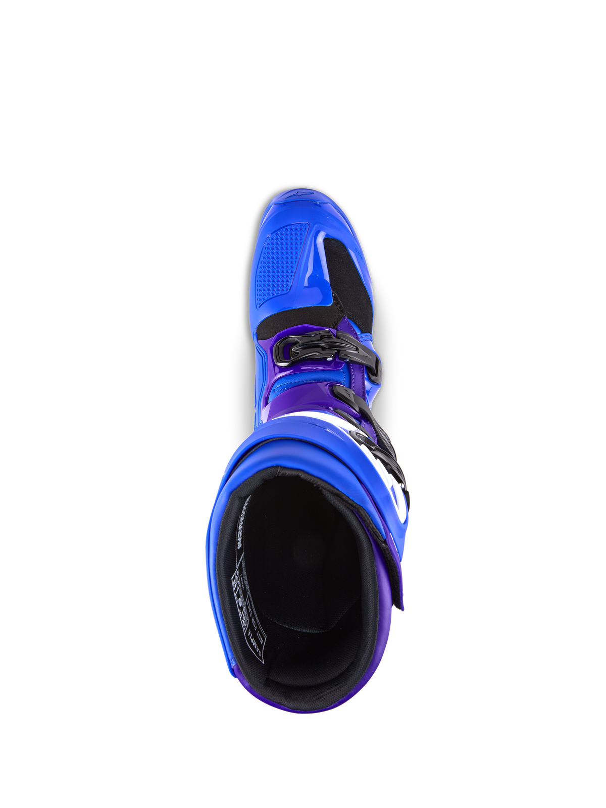 Bottes Alpinestars Tech 7, bottes de motocross, bleues avec accents violets et noirs, vue de dessus montrant la doublure intérieure et le système de boucles, construction durable en TPU et microfibre pour la performance tout-terrain