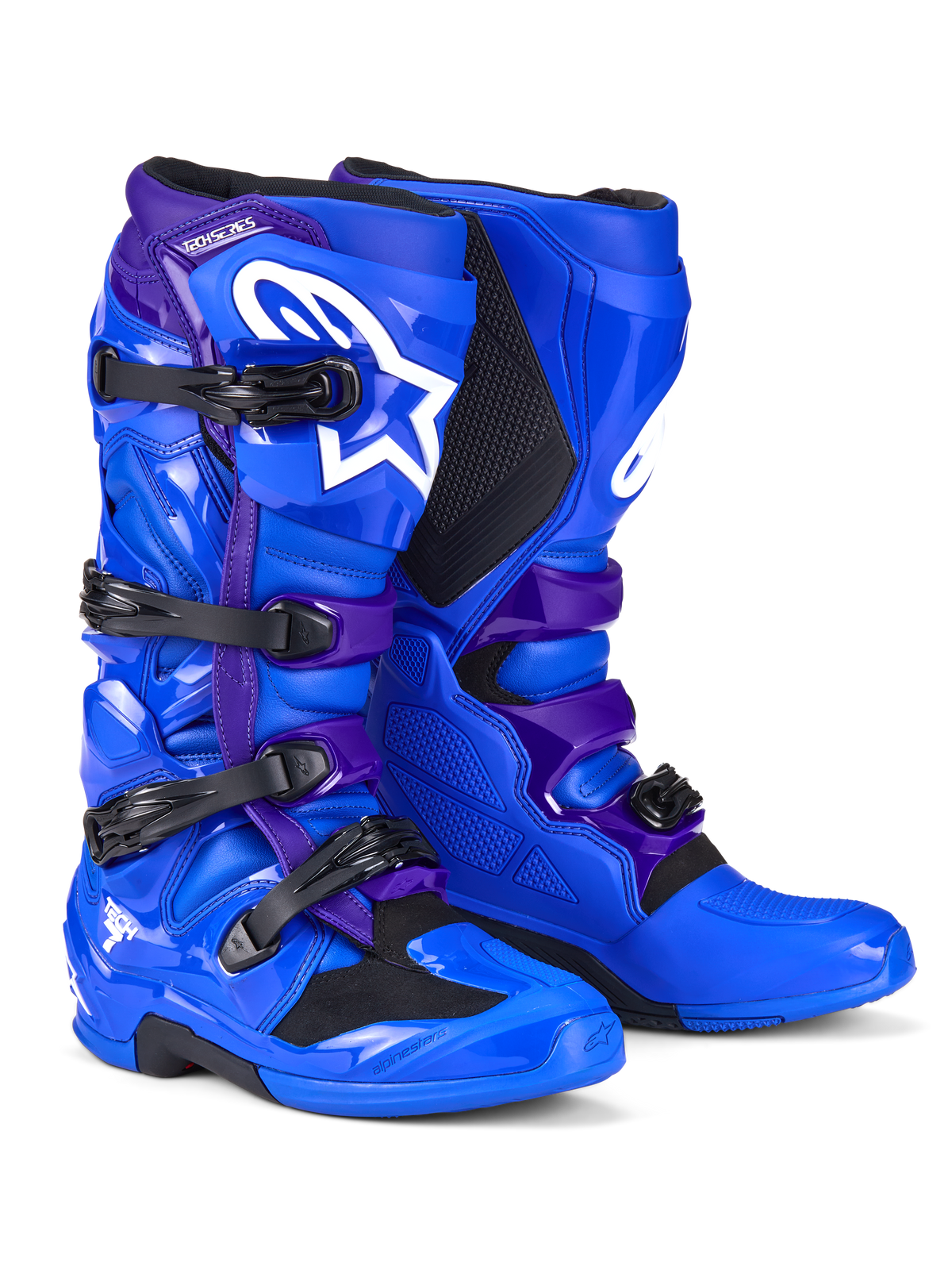 Bottes Alpinestars Tech 7, bottes de motocross, bleu et violet, avec logos Alpinestars blancs, panneaux de protection en TPU, système de fermeture à quatre boucles et semelle tout-terrain robuste