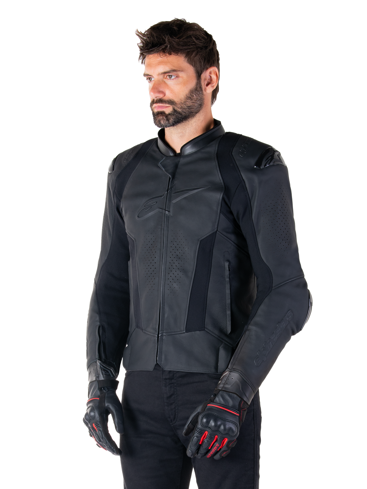 Male rider wearing the Alpinestars Missile V3 Leather Jacket in Black, premium bovine leather with perforated chest panels and external DFS shoulder protectors, paired with black pants and black/red racing gloves.