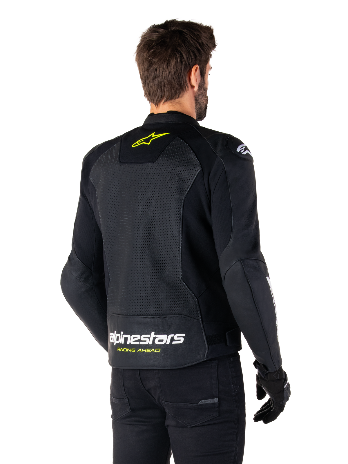 Alpinestars Faster V3 Airflow Lederjacke, Schwarz, Weiß und Gelb Fluo, Rückansicht, mit einem großen perforierten Leder-Rückenpanel zur Belüftung, gelbem Stern-Logo am Kragen und weißem Alpinestars-Schriftzug mit gelbem „Racing Ahead“-Text am unteren Saum, sportliche Motorradbekleidung