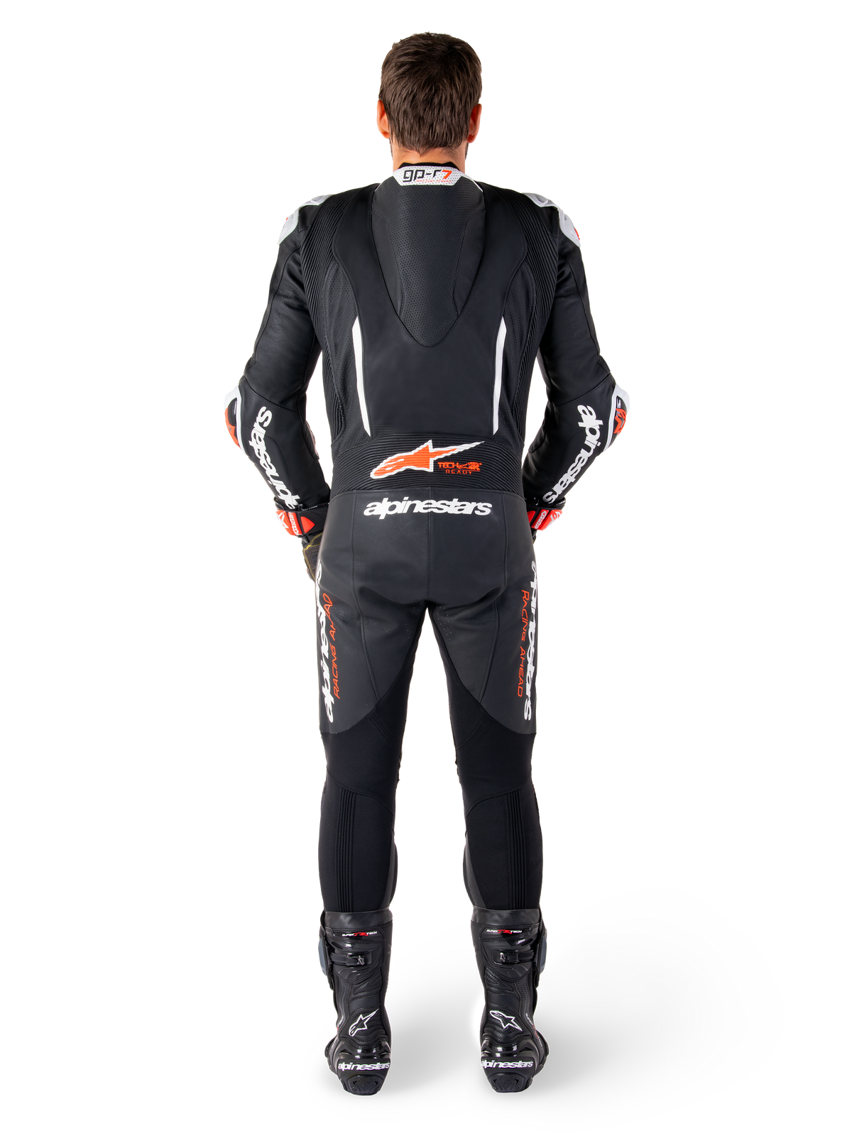 Alpinestars GP-R7 Lederkombi, Schwarz und Weiß, mit aerodynamischem Höcker und Akkordeon-Einsätzen für den Rennsport.