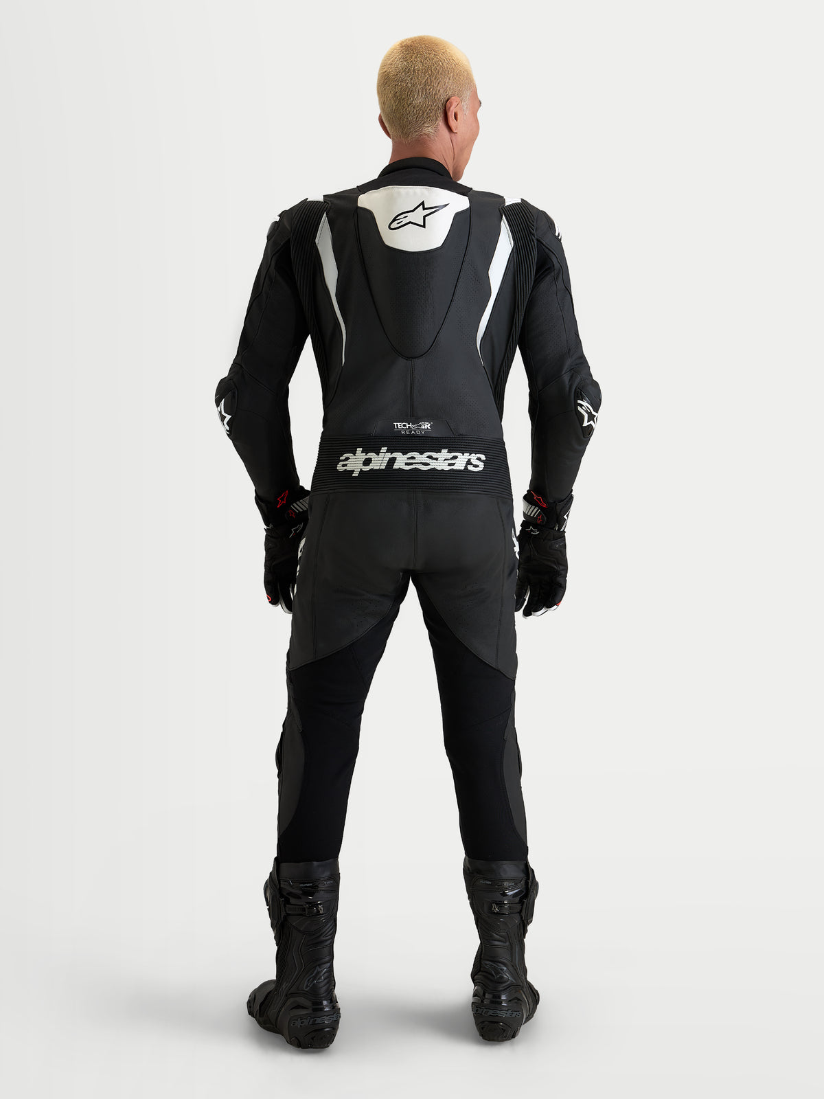 Alpinestars Missile V3 leren racepak 1-delig, heren motorpak, zwart en wit, achteraanzicht met aerodynamische bult en Alpinestars-branding