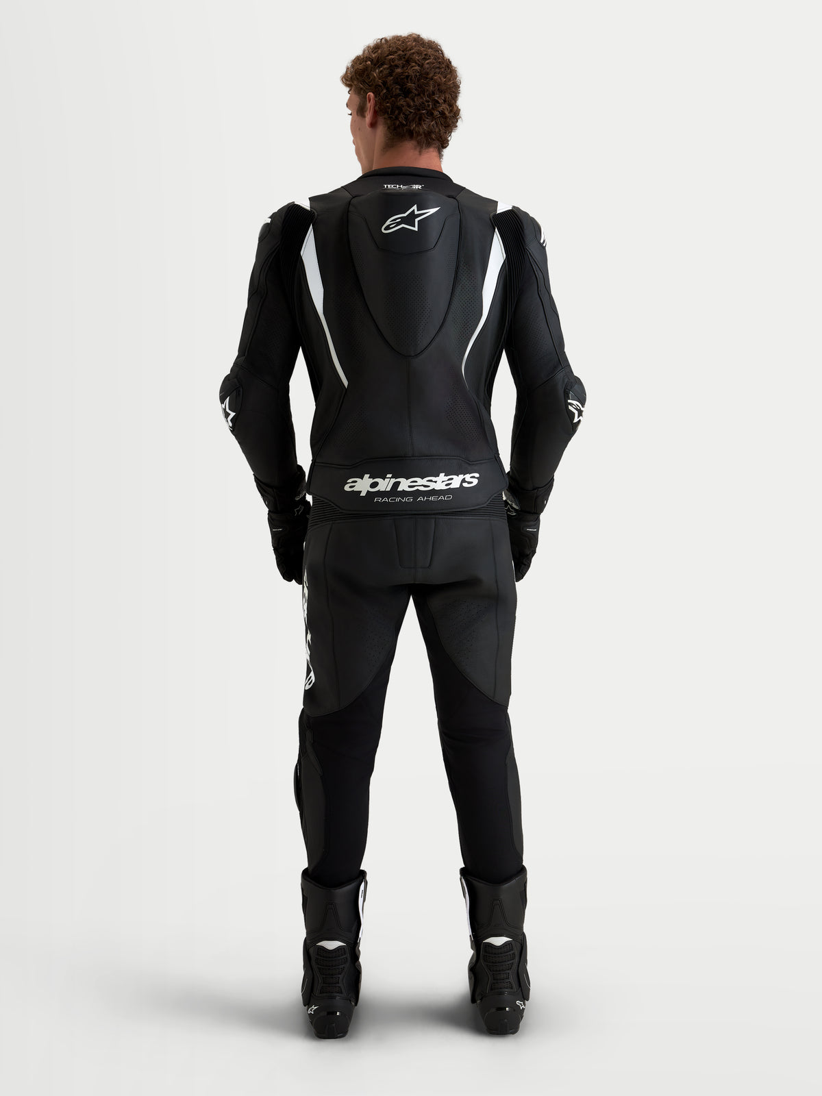 Alpinestars Missile V3 2-delig leren pak, heren motorracingpak, zwart en wit, achteraanzicht met aerodynamische bult, geperforeerde lederen constructie en CE-certificering