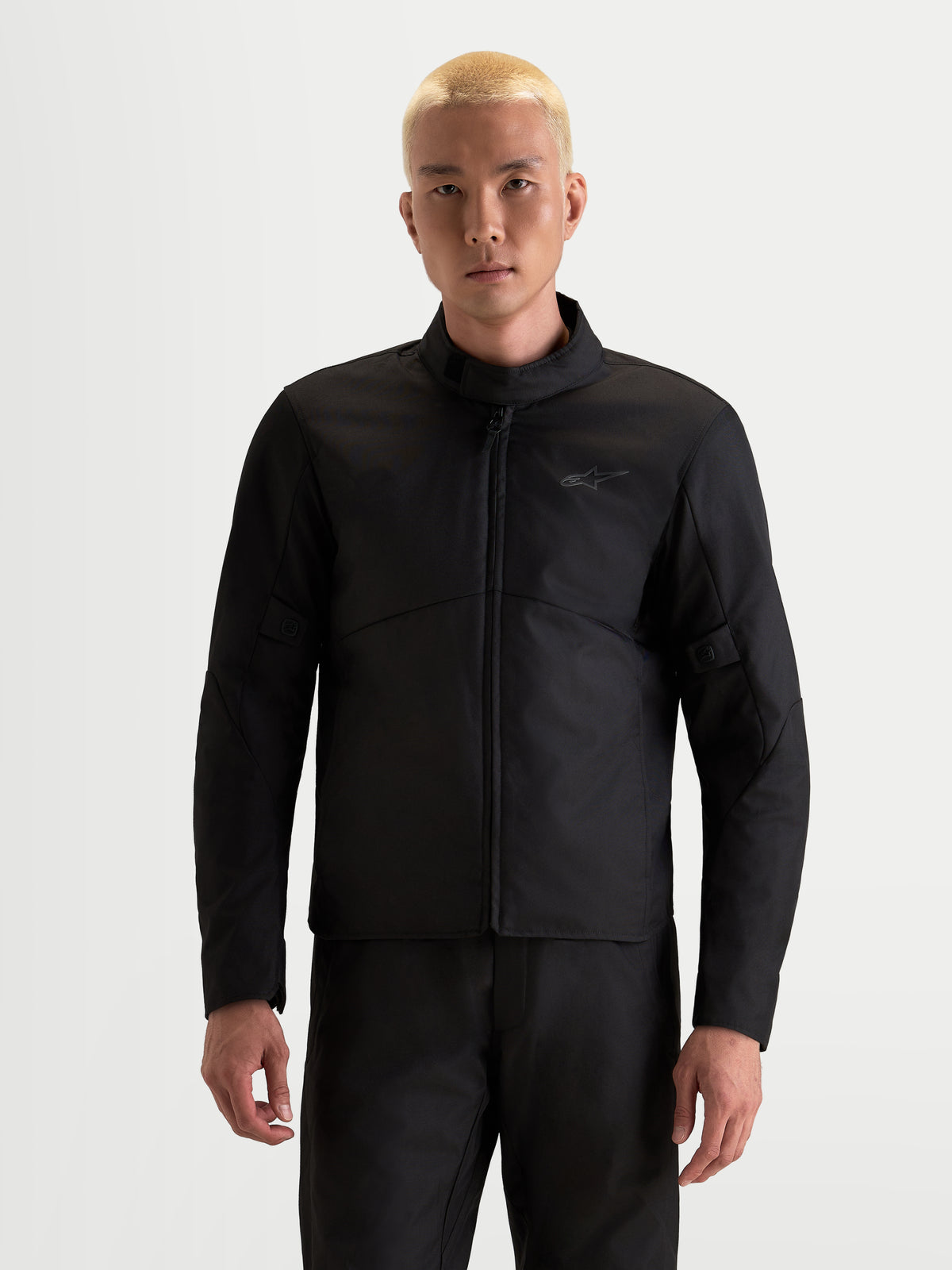 Alpinestars C-1 Waterproof Jacket, men's urban motorcycle jacket in black, front view worn by a model showcasing waterproof textile construction and high collar.