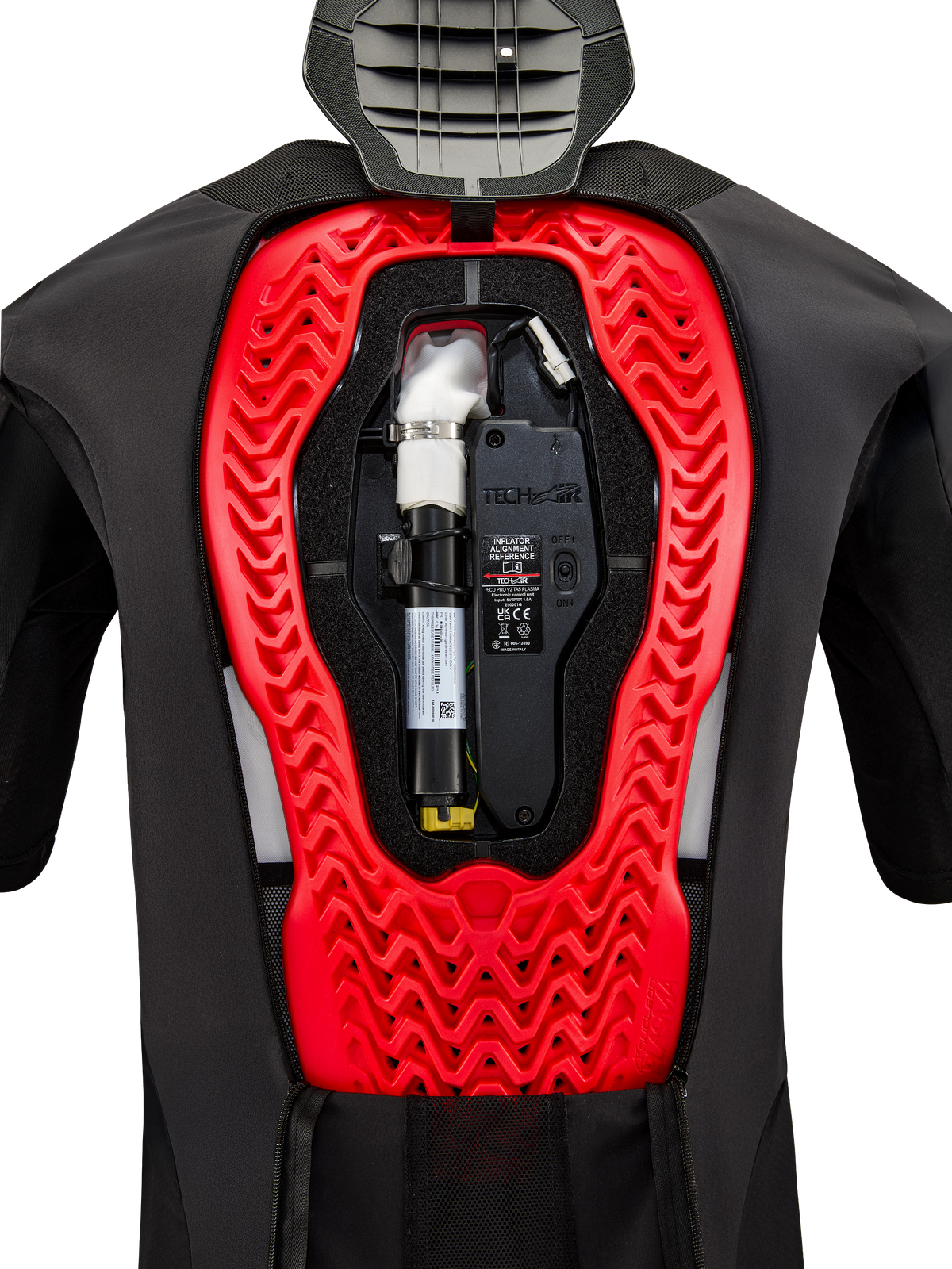 Alpinestars Tech-Air 5 Plasma Airbagsysteem, binnenaanzicht met de geïnstalleerde zwarte vervangende canister en elektronische besturingseenheid, geïntegreerd in een felrode Nucleon Plasma rugprotector in een zwart beschermend vest