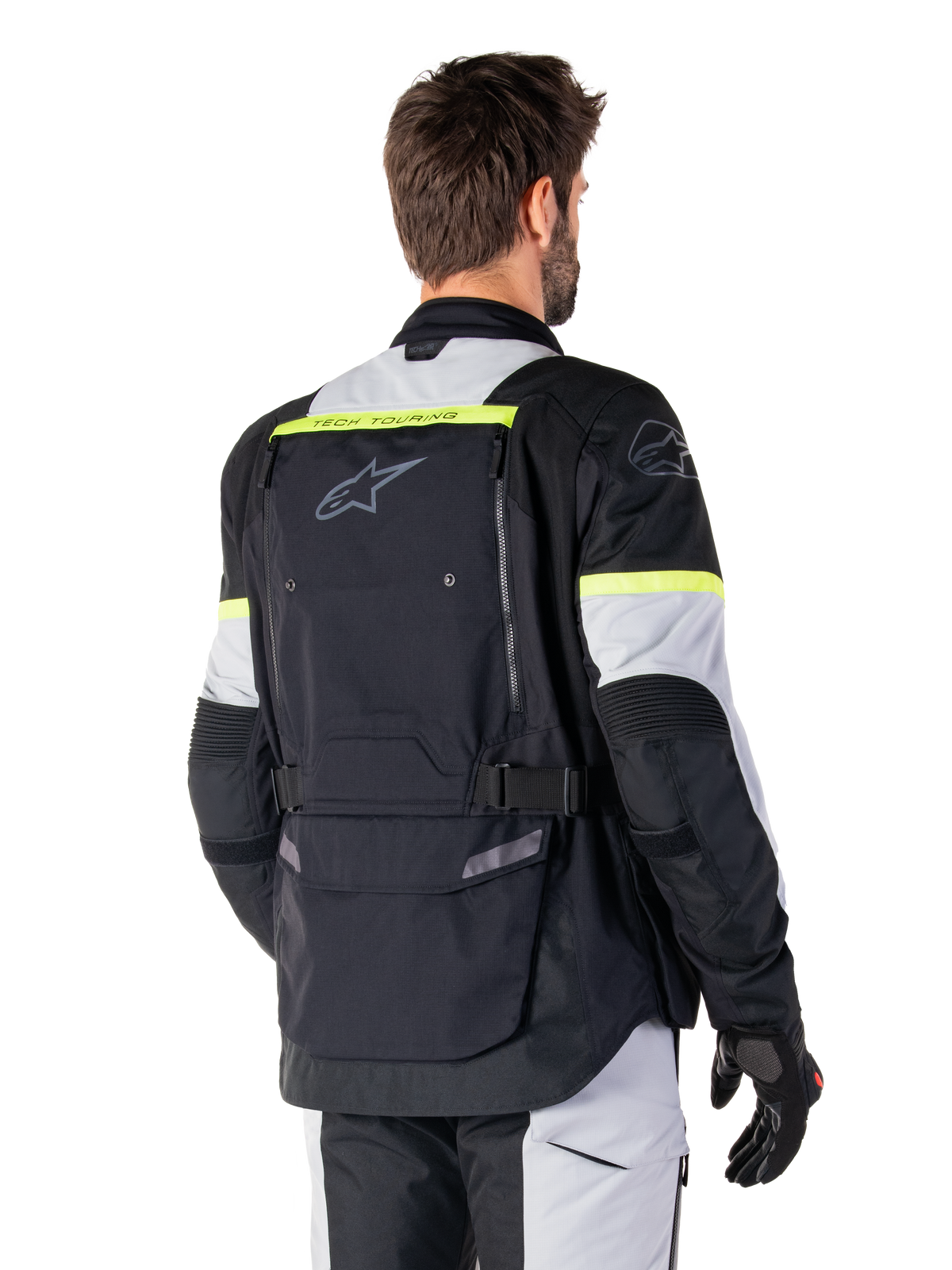 Alpinestars Bogotá Pro Drystar® jas, heren adventure touring motorjas, zwart en ijsgrijs met geel fluo accenten, achteraanzicht met grote achterzak en Tech-Air® voorbereiding, waterdicht, CE-gecertificeerd.
