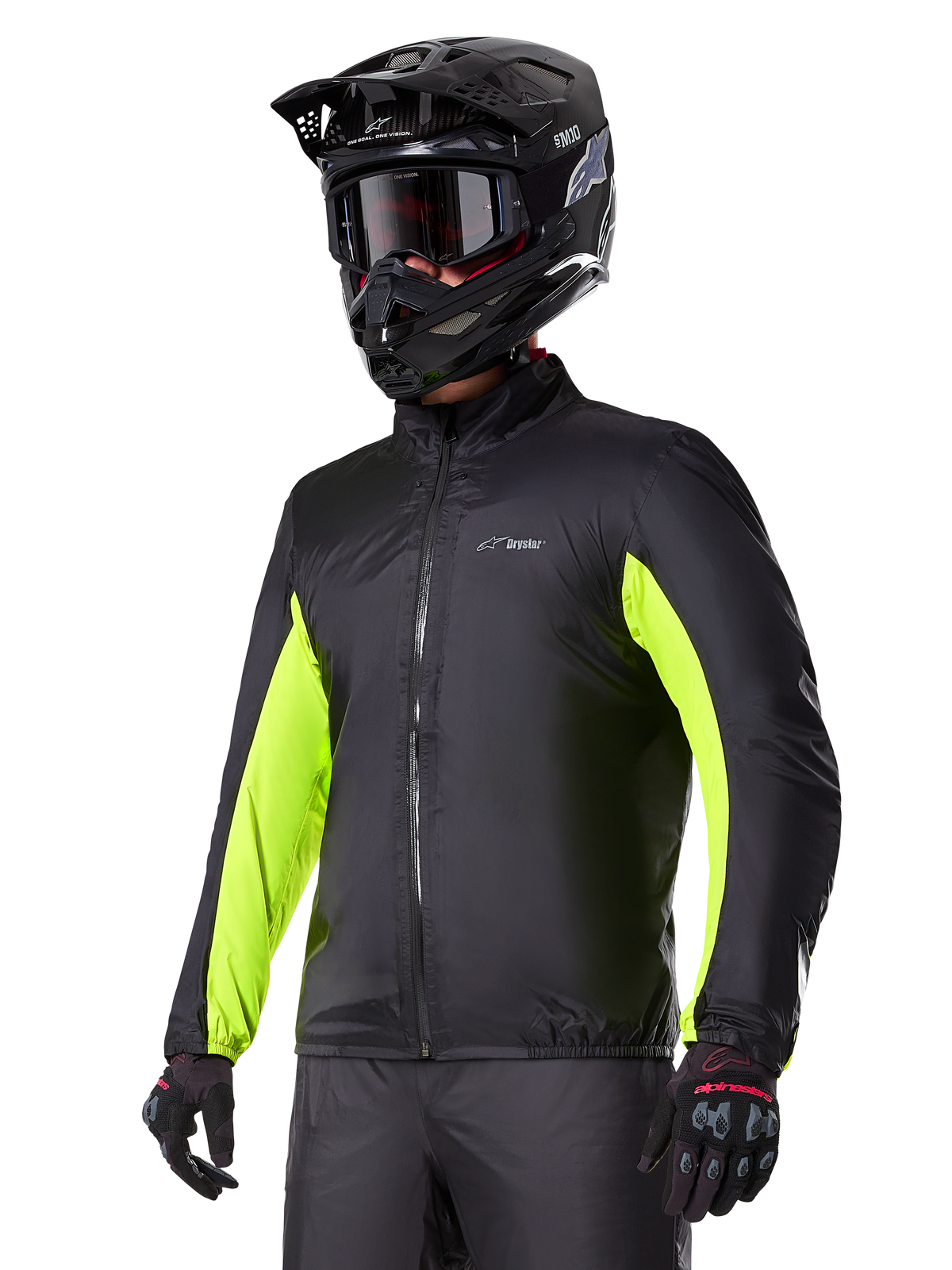 Alpinestars Bogotá Pro Drystar® jas waterdichte voering, zwart en geel fluo, gedragen door rijder met helm en crossbril.