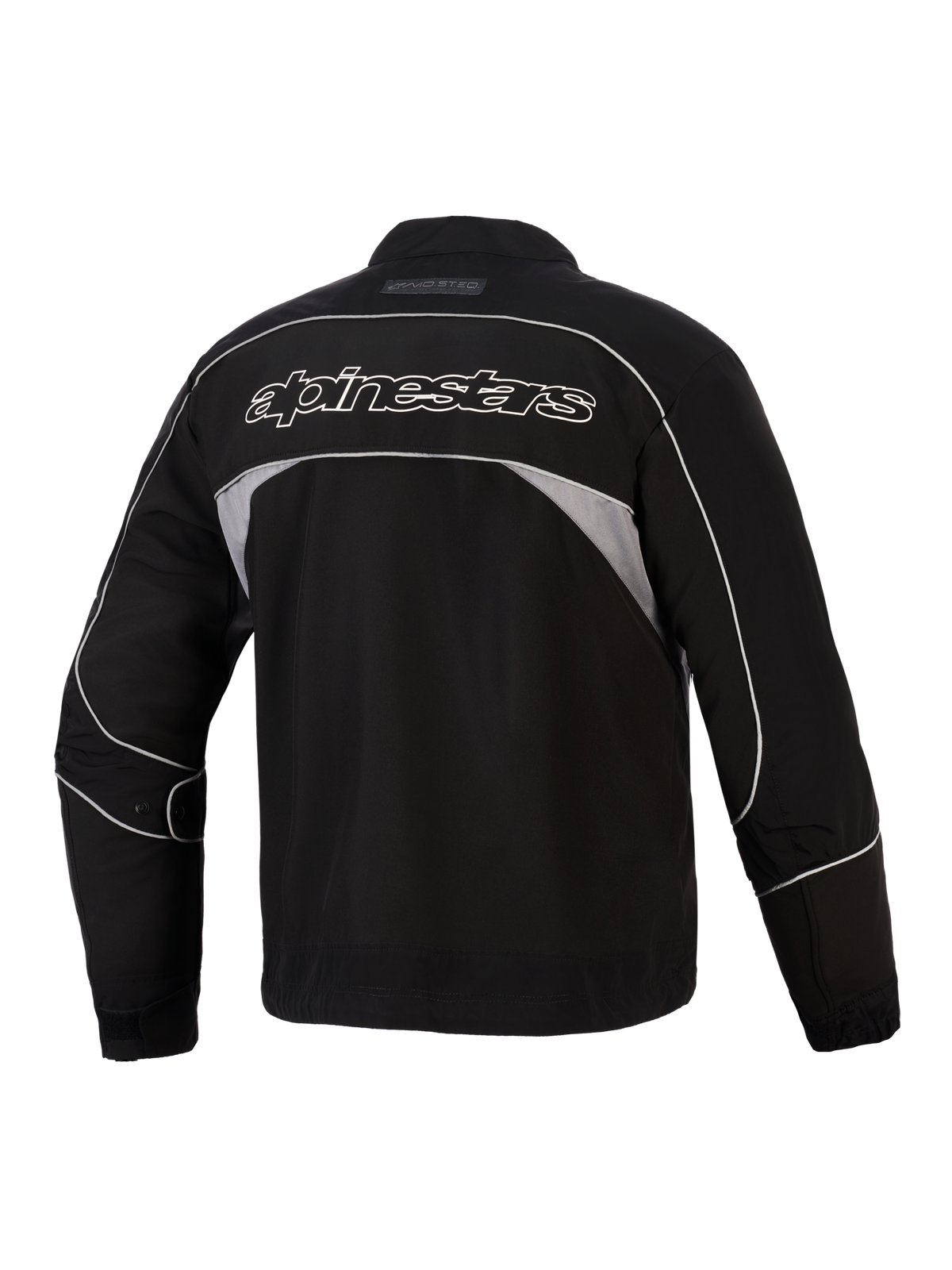 Veste Alpinestars Unite, vue arrière, noire avec panneaux réfléchissants gris foncé, logo Alpinestars à contour blanc dans le dos, veste de moto urbaine en softshell au design minimaliste