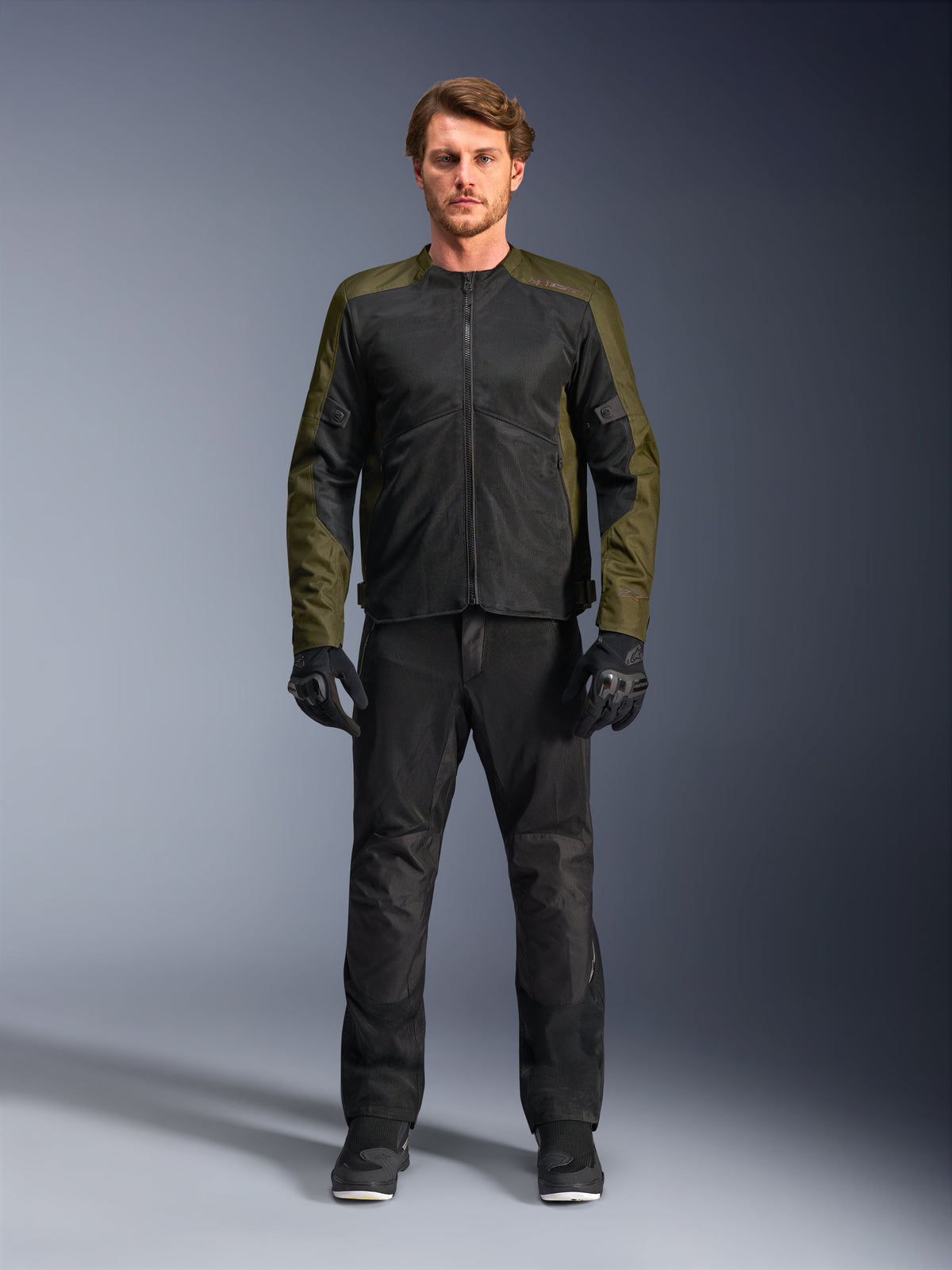 Alpinestars C-1 Air Jacket, Khaki and Black, worn by male model with black motorcycle pants and gloves, lightweight textile design with tech mesh panels, urban contemporary riding gear