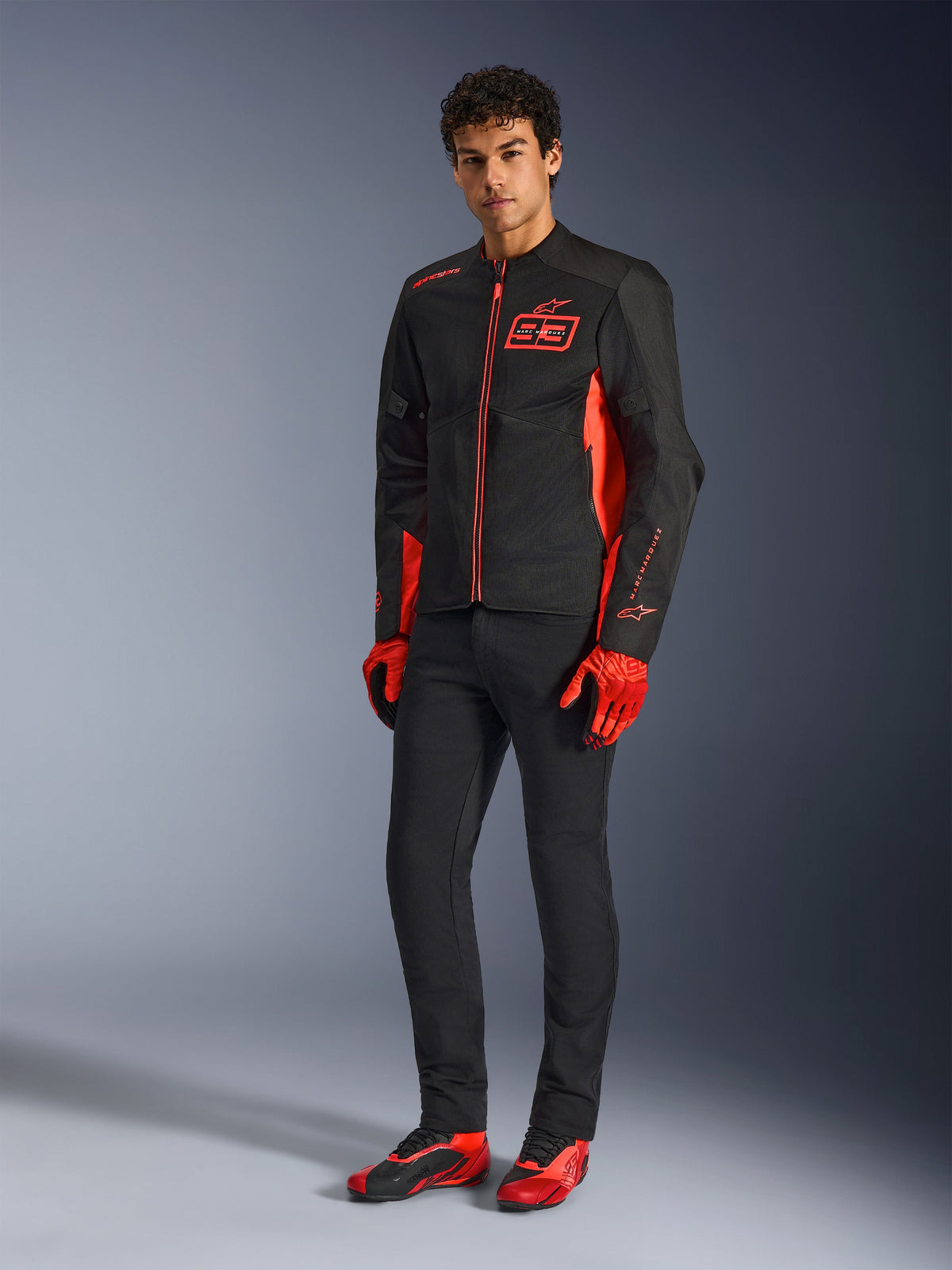 Alpinestars MM93 C-1 Air Jacket, Motorcycle Jacket, Red Fluo Bright Red and Black, worn with red gloves, black pants and red riding shoes, featuring MM93 branding and lightweight mesh construction, urban contemporary riding gear