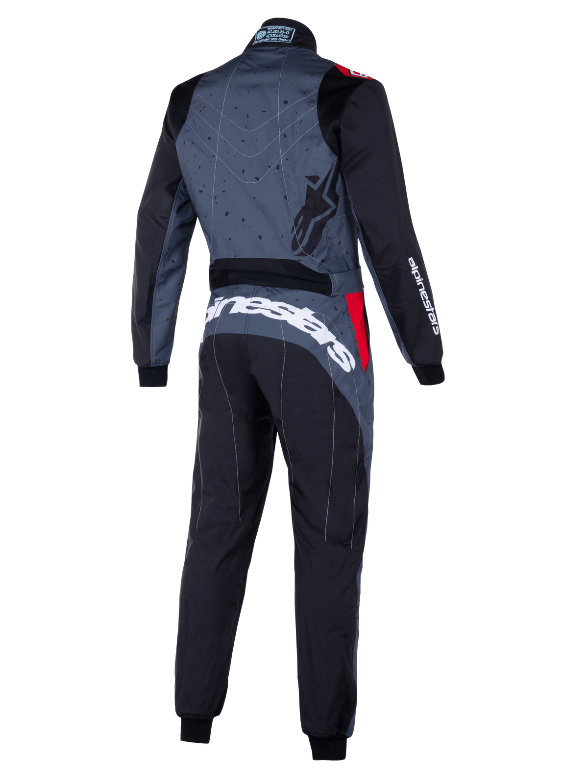 Combinaison Alpinestars KMX-9 V3 Graphic 6, combinaison de karting grise et noire avec accents rouges, vue arrière montrant le dos à motifs graphiques, logo Alpinestars blanc imposant dans le bas du dos et panneaux ergonomiques pour la performance.