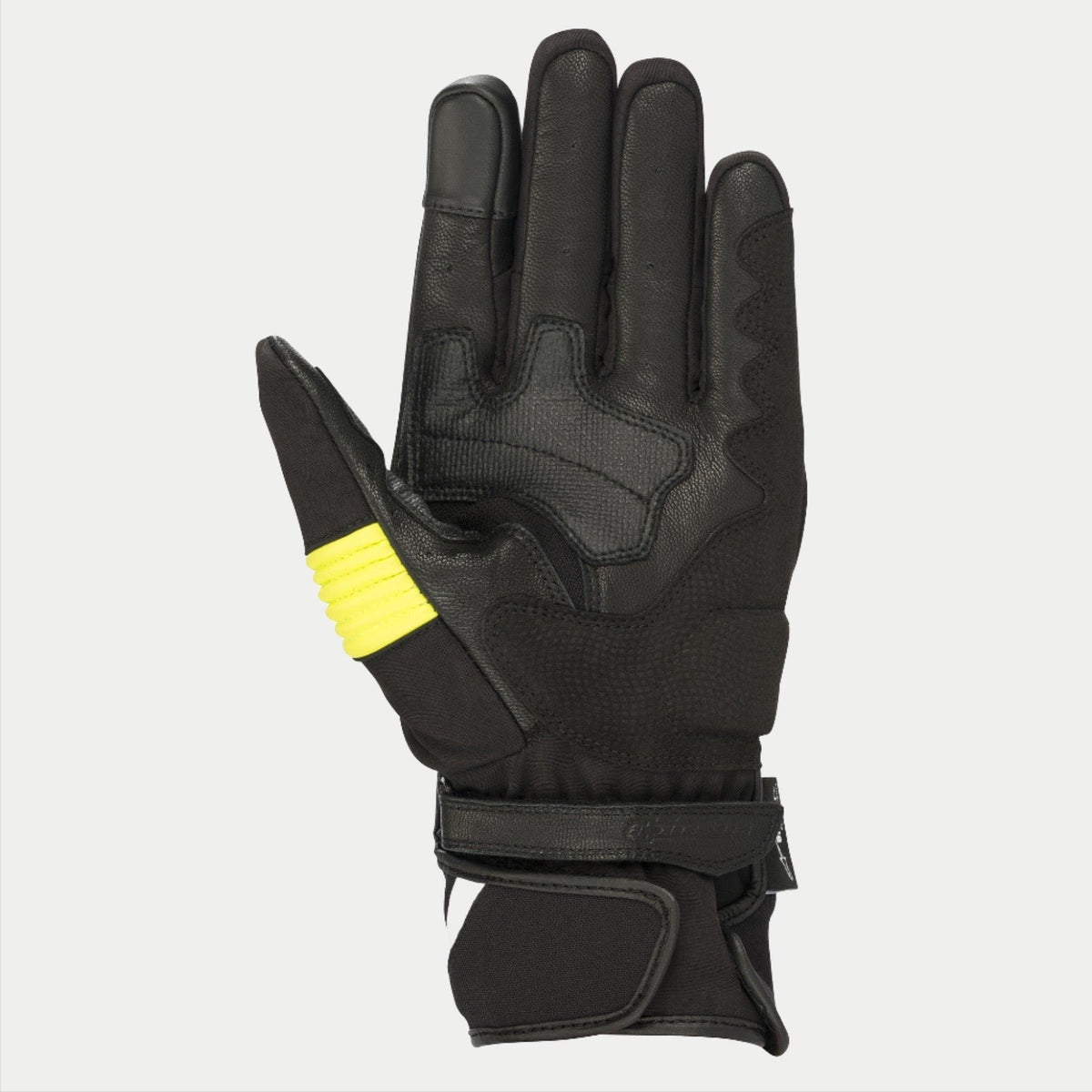 Alpinestars T-SP W Drystar® handschoenen, zwart en fluoriserend geel, handpalmaanzicht met constructie van geitenleer, fluoriserend gele accenten op de duim, touchscreen-compatibele vingertoppen en dubbele klittenbandsluiting aan de pols.