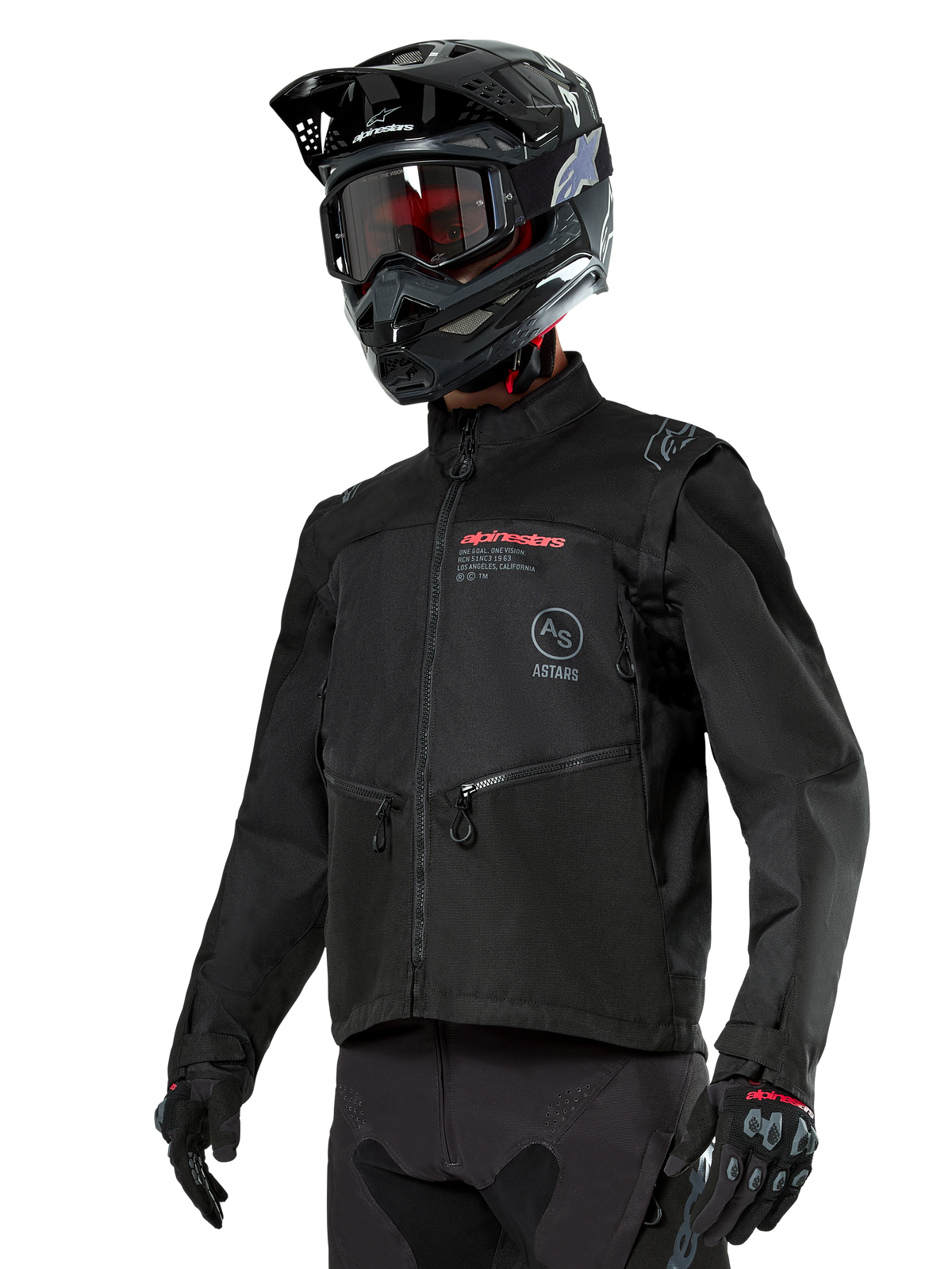 Alpinestars Pro-Dura Jacket, veste de moto tout-terrain, noire avec logos rouges et gris, dotée de poches avant zippées et d'un col montant, portée avec un casque de motocross noir et des gants pour l'enduro