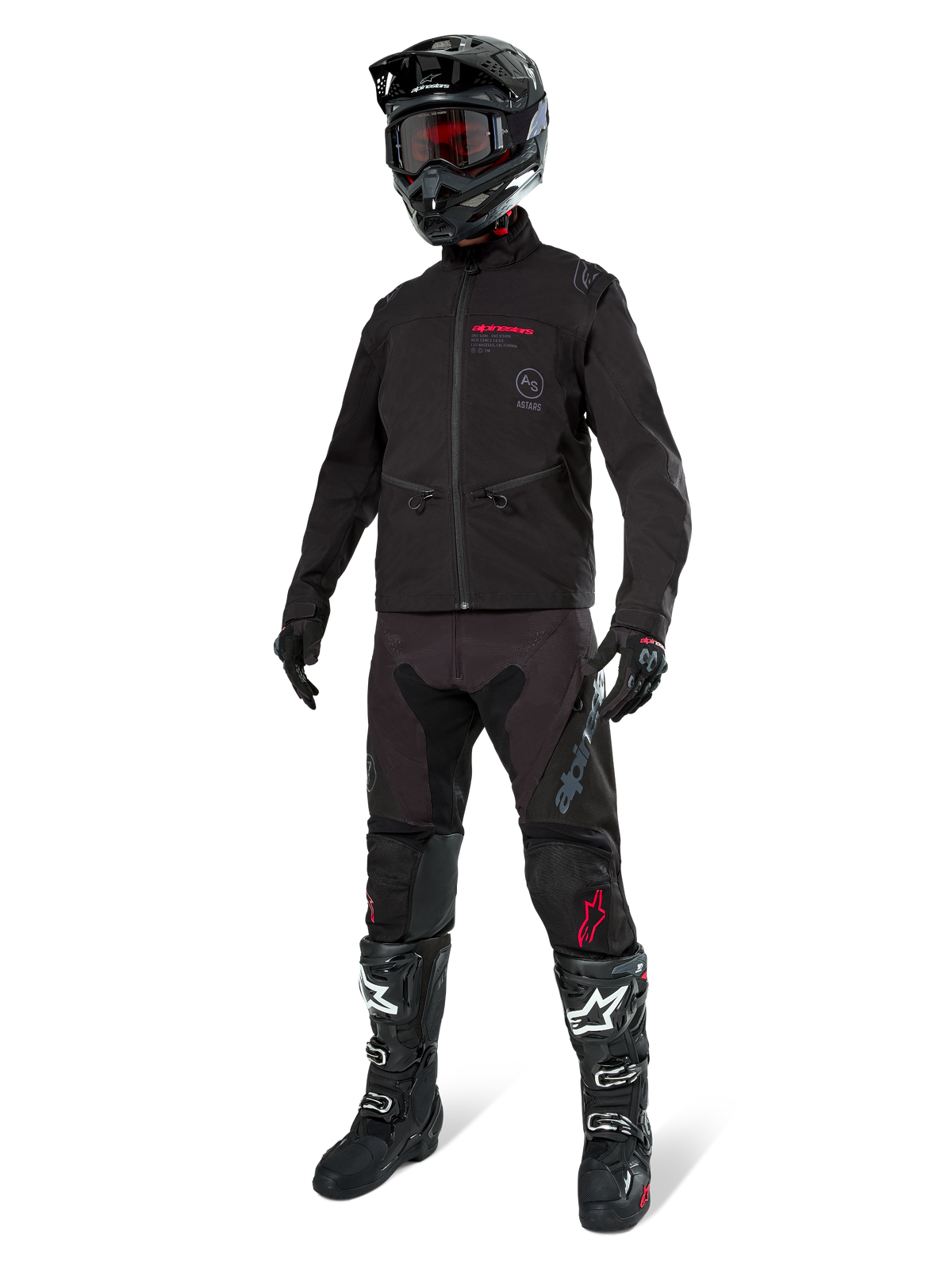 Alpinestars Lite-Dura Softshell-Jacke, Schwarz, getragen von einer Schaufensterpuppe als Teil einer kompletten Offroad-Ausrüstung inklusive schwarzer Hose, schwarz-weißer Stiefel und schwarzem Helm mit roter Brille, professionelle Motocross- und Enduro-Bekleidung.