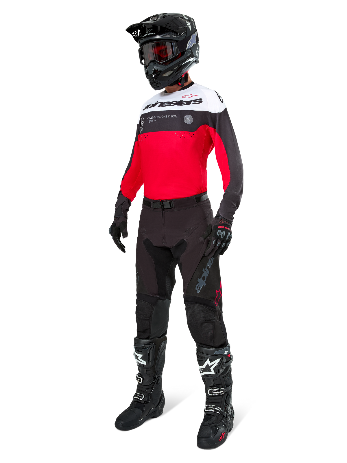 Pantalon Alpinestars Pro-Dura en coloris Black Magnet White, porté par un pilote avec un maillot assorti rouge, noir et blanc, un casque noir et des bottes tout-terrain noires, ensemble complet d'équipement de course enduro professionnel pour la performance tout-terrain.