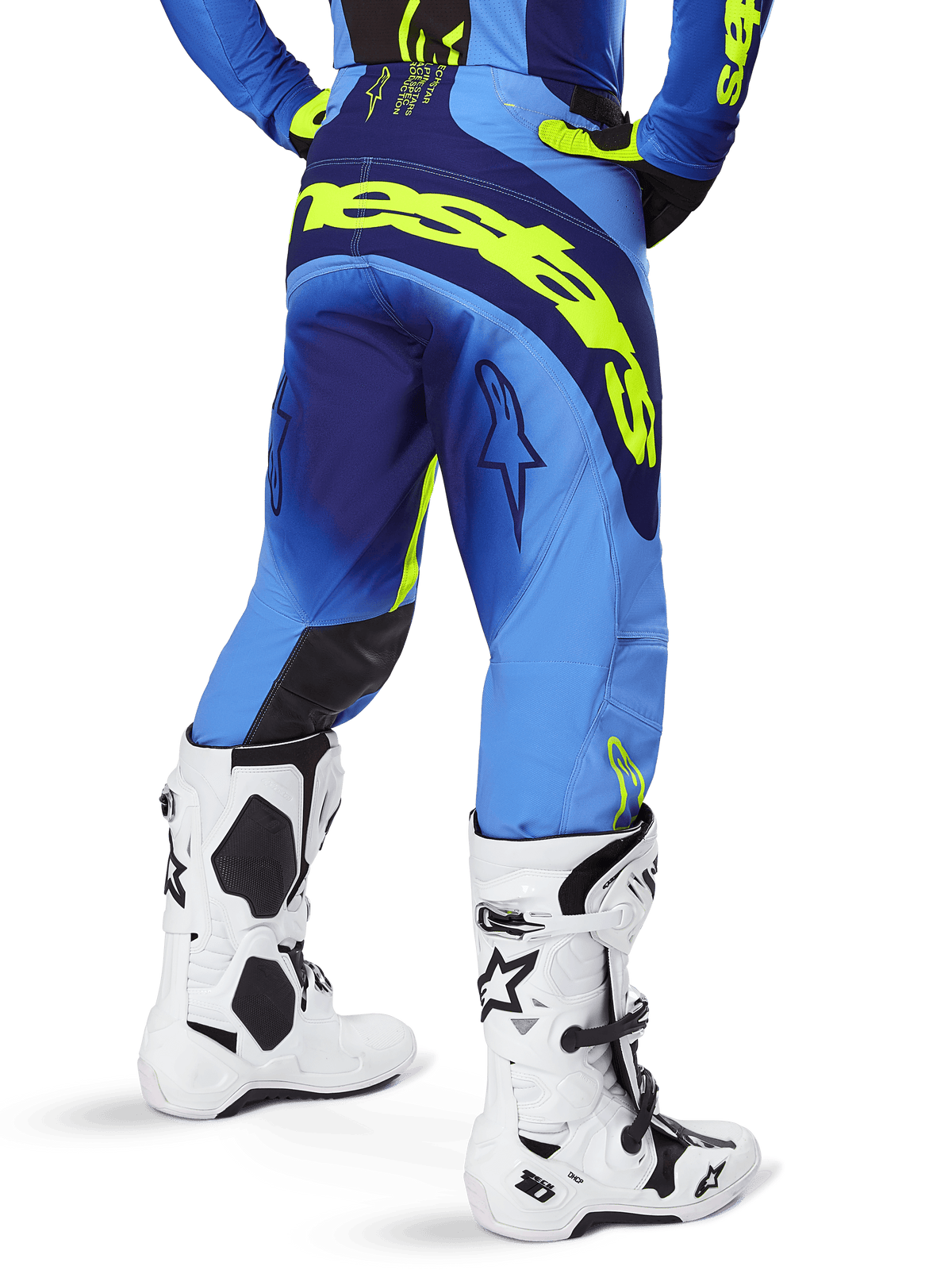 Alpinestars 2025 Techstar Melt Hose, Motocross-Hose, Blau und Gelb Fluo, Rückansicht mit großem gelbem Branding auf dem Gesäß und den Oberschenkeln, getragen mit weißen Motocross-Stiefeln und passendem blauem Trikot, athletische Rennpassform für Offroad-Fahrten