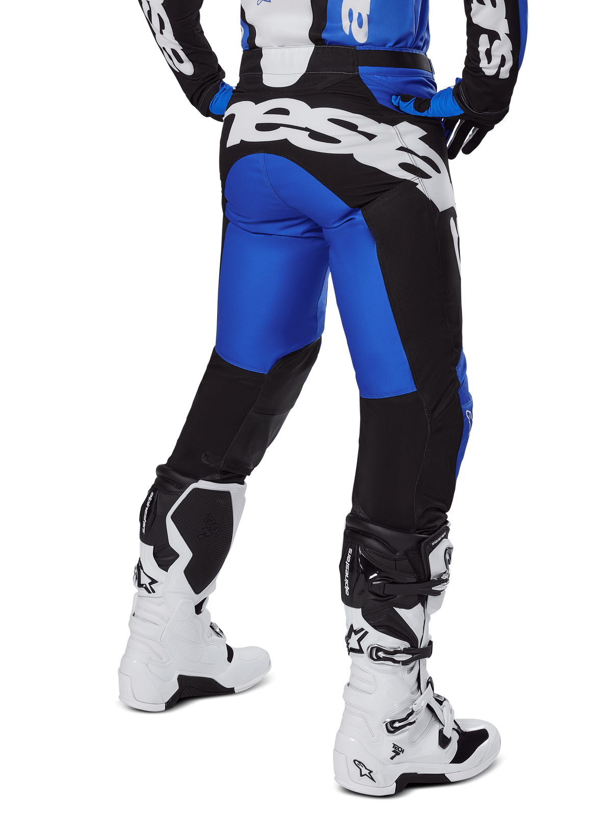 Alpinestars 2025 Racer Veil Pants, Motocross Pants, Blue and Black, rear view showing large white branding on the seat, worn with matching jersey and white boots, durable technical material for off-road riding