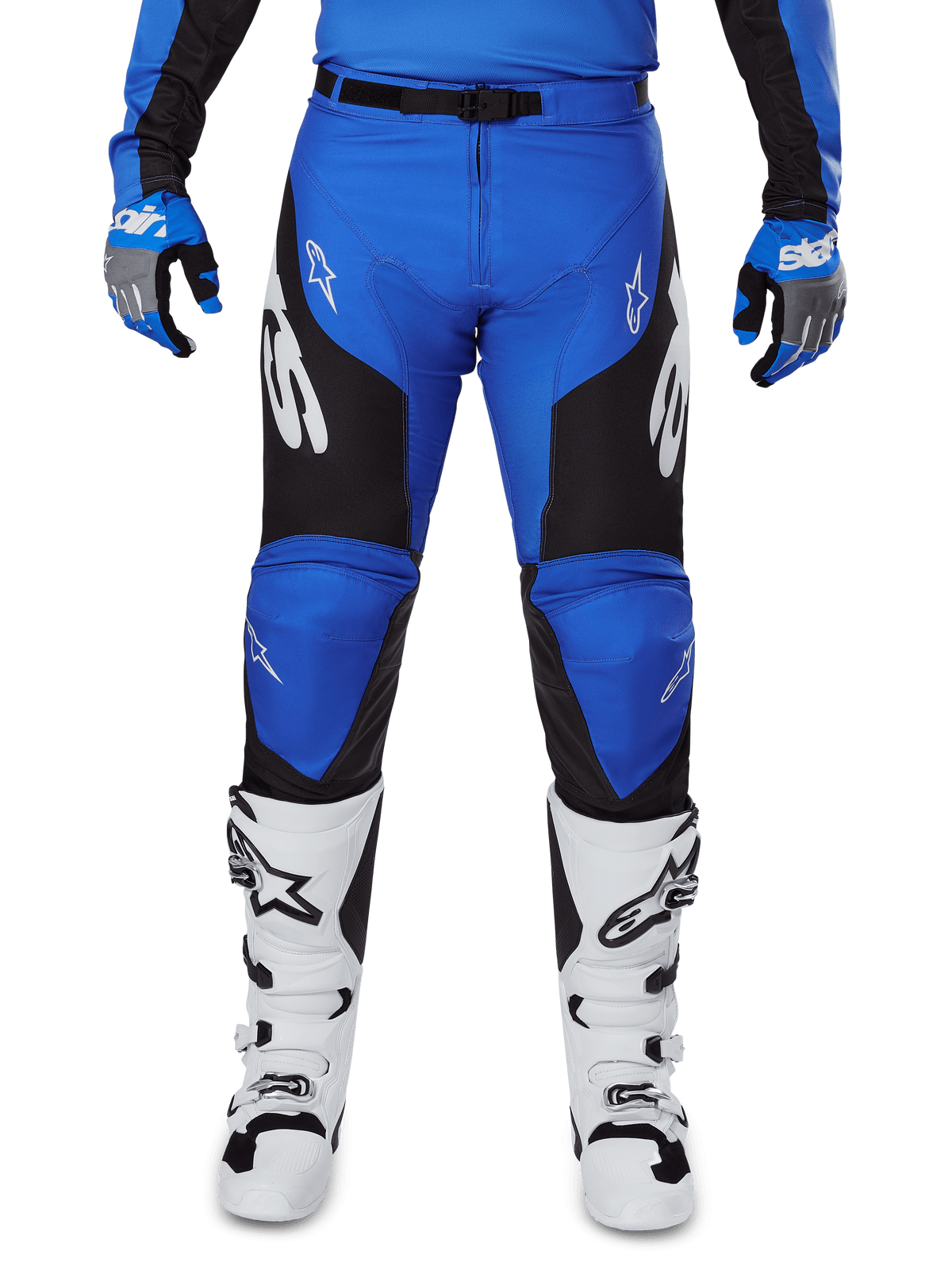 Alpinestars 2025 Racer Veil Pants, Motocross Pants, Blue and Black, featuring white Alpinestars logos on the legs, black side panels, worn with white motocross boots and blue/grey gloves, high-performance off-road riding gear