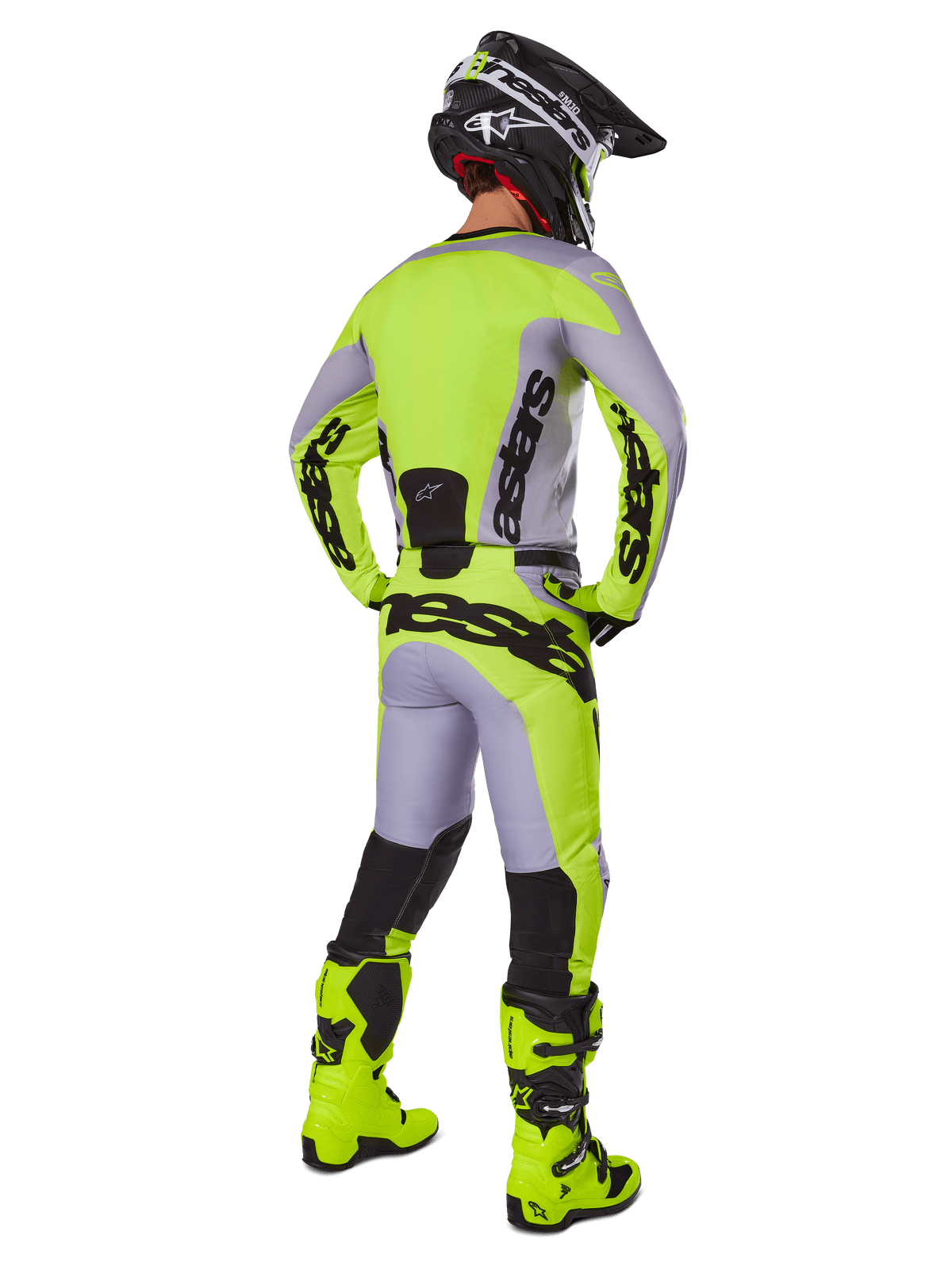 Alpinestars 2025 Racer Veil Pants, Motocross Pants, Gray and Fluorescent Yellow, rear view of rider in full gear, matching jersey and fluo yellow boots, featuring bold black logos, technical off-road racing kit.