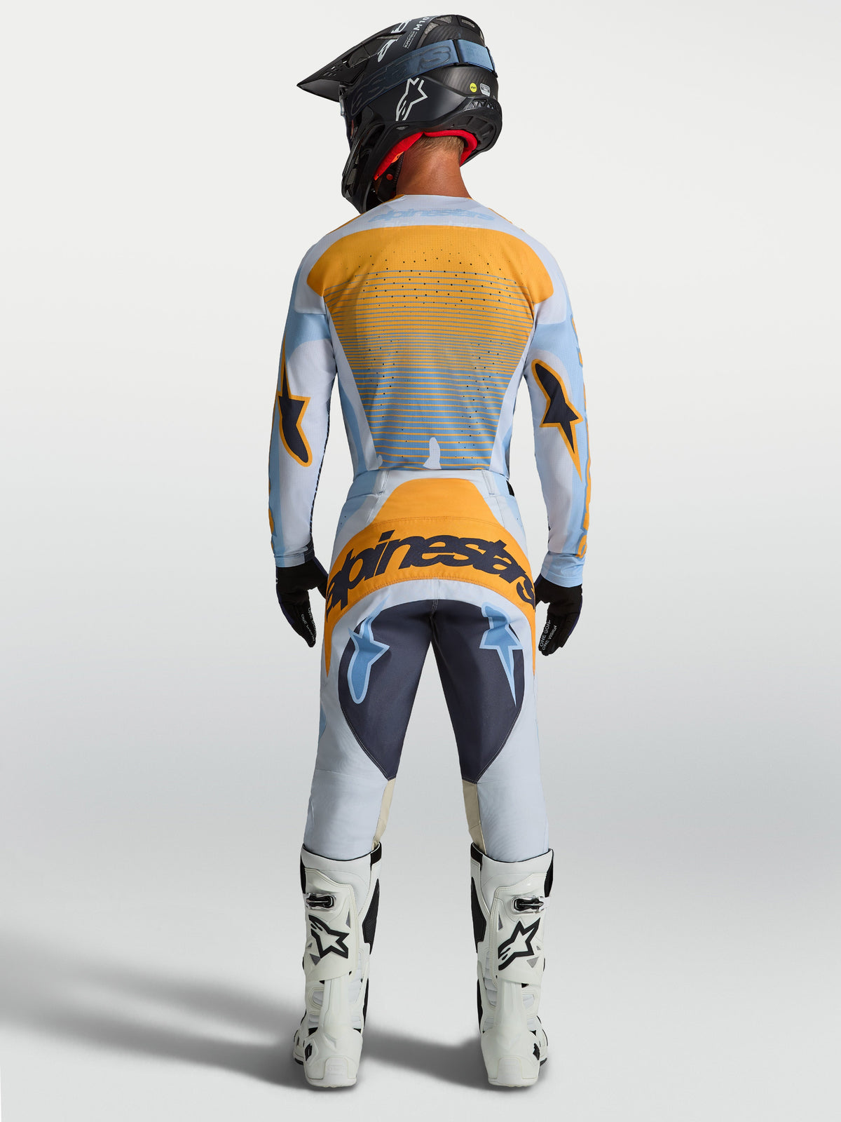 Pantalon Alpinestars Techstar Maven, pantalon de motocross pour homme, bleu et orange, vue arrière montrant l'assise renforcée et la coupe ergonomique.