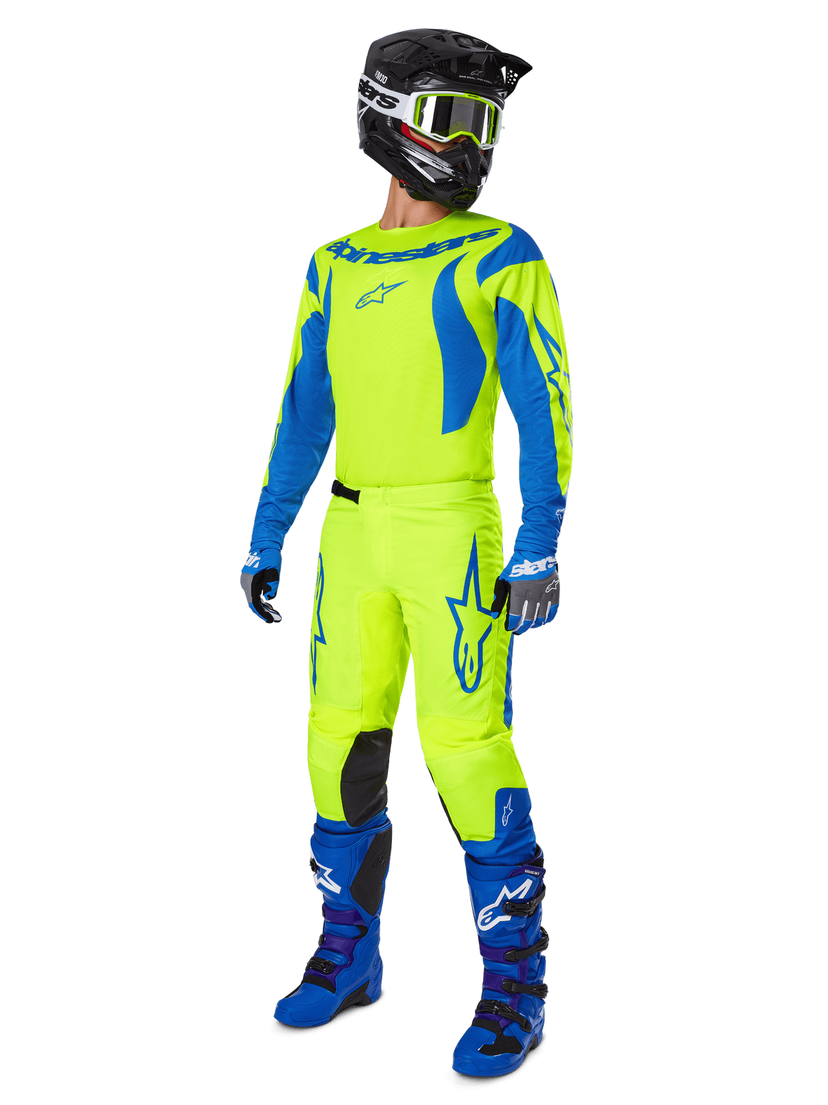 Alpinestars 2025 Fluid Haul Pants, pantalon de motocross, jaune fluo et bleu, porté avec un équipement de course complet comprenant un maillot assorti, des bottes bleues et un casque noir, design haute visibilité pour le tout-terrain