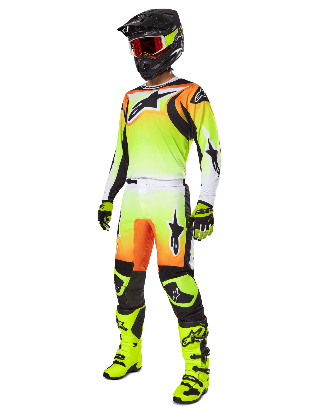 Alpinestars 2025 Fluid Wurx broek, motorcross broek in geel en zwart met een levendig geel-naar-wit kleurverloop en oranje accenten, gedragen door een motorcrosser als onderdeel van een complete outfit met bijpassende jersey, zwarte helm en neongele laarzen.