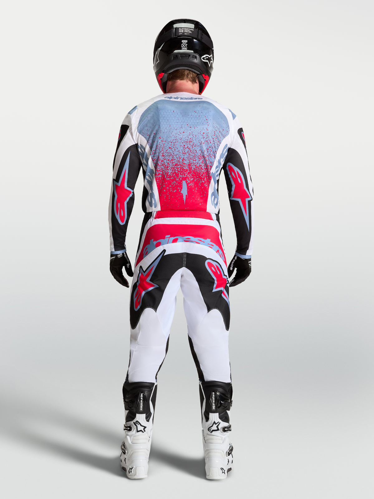 Alpinestars Fluid Drag broek, motorcrossbroek voor heren, zwart, wit en rood fluo, ergonomische 3D-patroonconstructie.