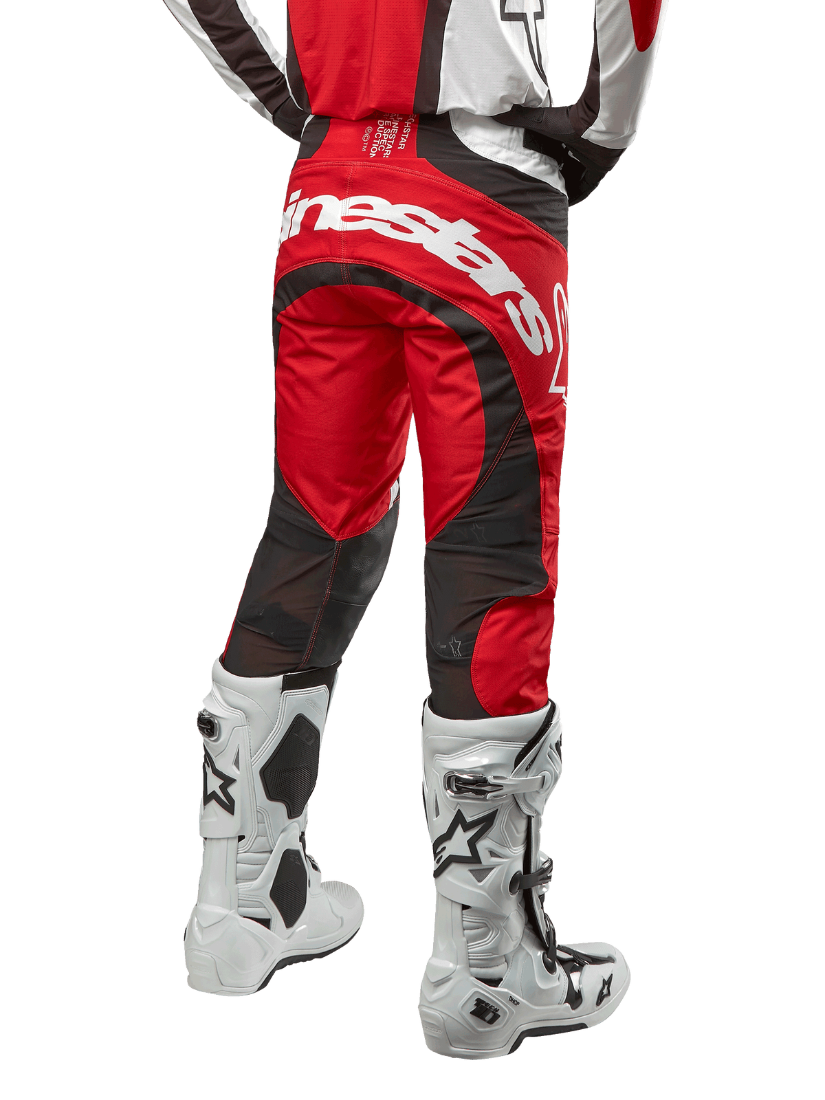 Alpinestars 2024 Techstar Ocuri Pants, Motocross Pants, Mars Red White and Black, back view featuring large white Alpinestars logo on the seat, black mesh ventilation panels, worn with white and black motocross boots, athletic race-fit design for off-road riding