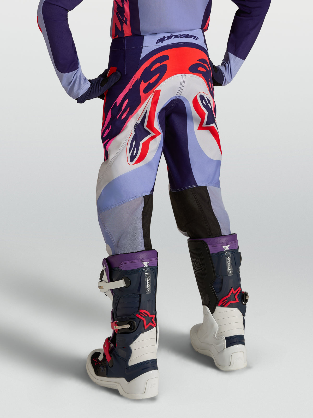 Alpinestars Youth Supertech Dyna Pants, purple and pink fluo motocross gear with durable stretch rip-stop textile.