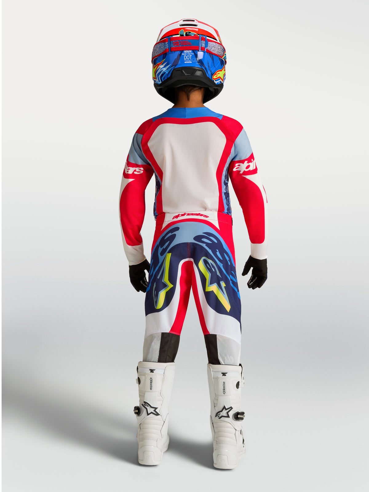Pantalon Alpinestars Supertech Dyna Junior, équipement de motocross pour enfant, rouge et bleu marine, vue de dos.