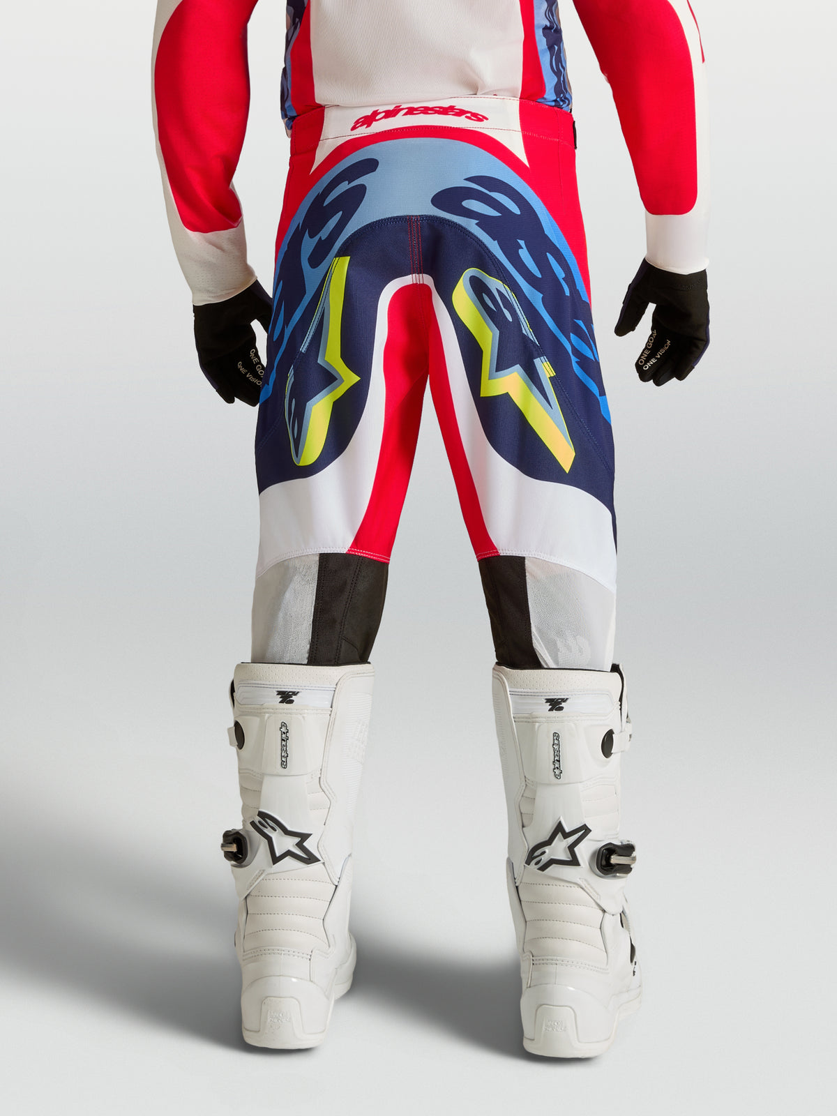 Alpinestars Supertech Dyna Junior, pantalon de motocross rouge, bleu et blanc, construction stretch, vue de dos