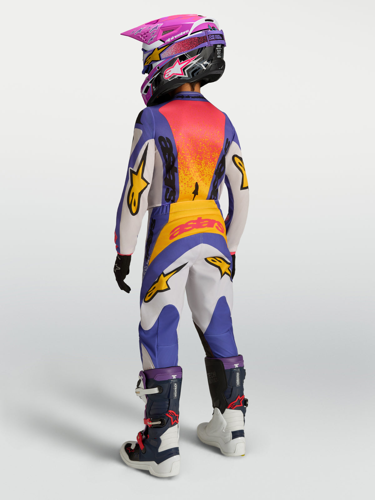 Alpinestars Jeugd Fluid Drag broek, blauwe en gouden motorcrossbroek voor de jeugd, achteraanzicht, duurzame polystof.
