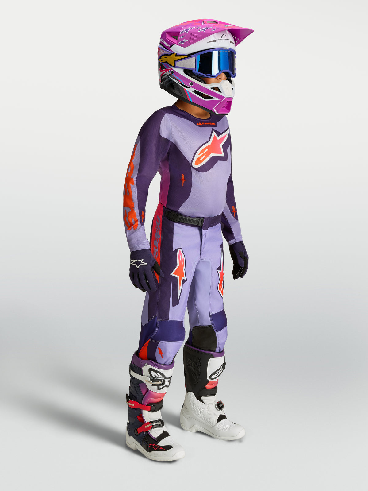 Alpinestars Youth Fluid Hunt Pants, purple and violet motocross gear set for young riders with helmet and boots.