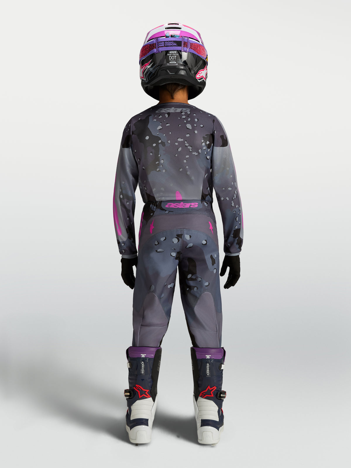 Alpinestars Fluid Lone Junior, ensemble de motocross gris et rose avec motifs camo techniques, vue de dos.
