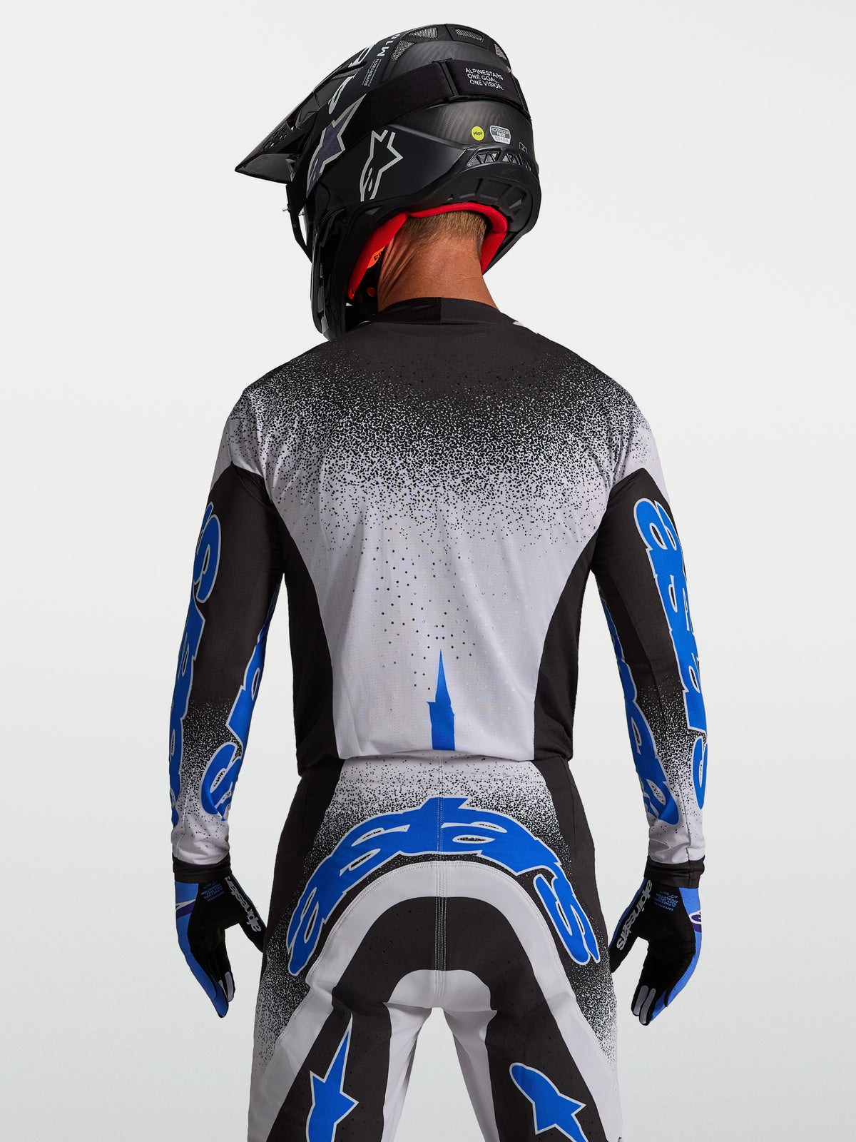 Alpinestars Supertech Hiten AFD Trikot, Motocross-Rennsport, Herren, Schwarz und Blau, Rückansicht mit athletischer Passform.