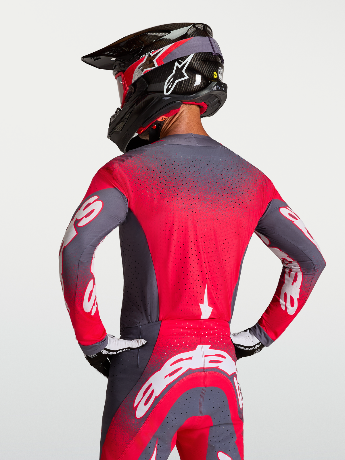 Alpinestars Supertech Hiten AFD Jersey, motorcrossracing-shirt in grijs en fluo rood met Stretchnet-ventilatie.
