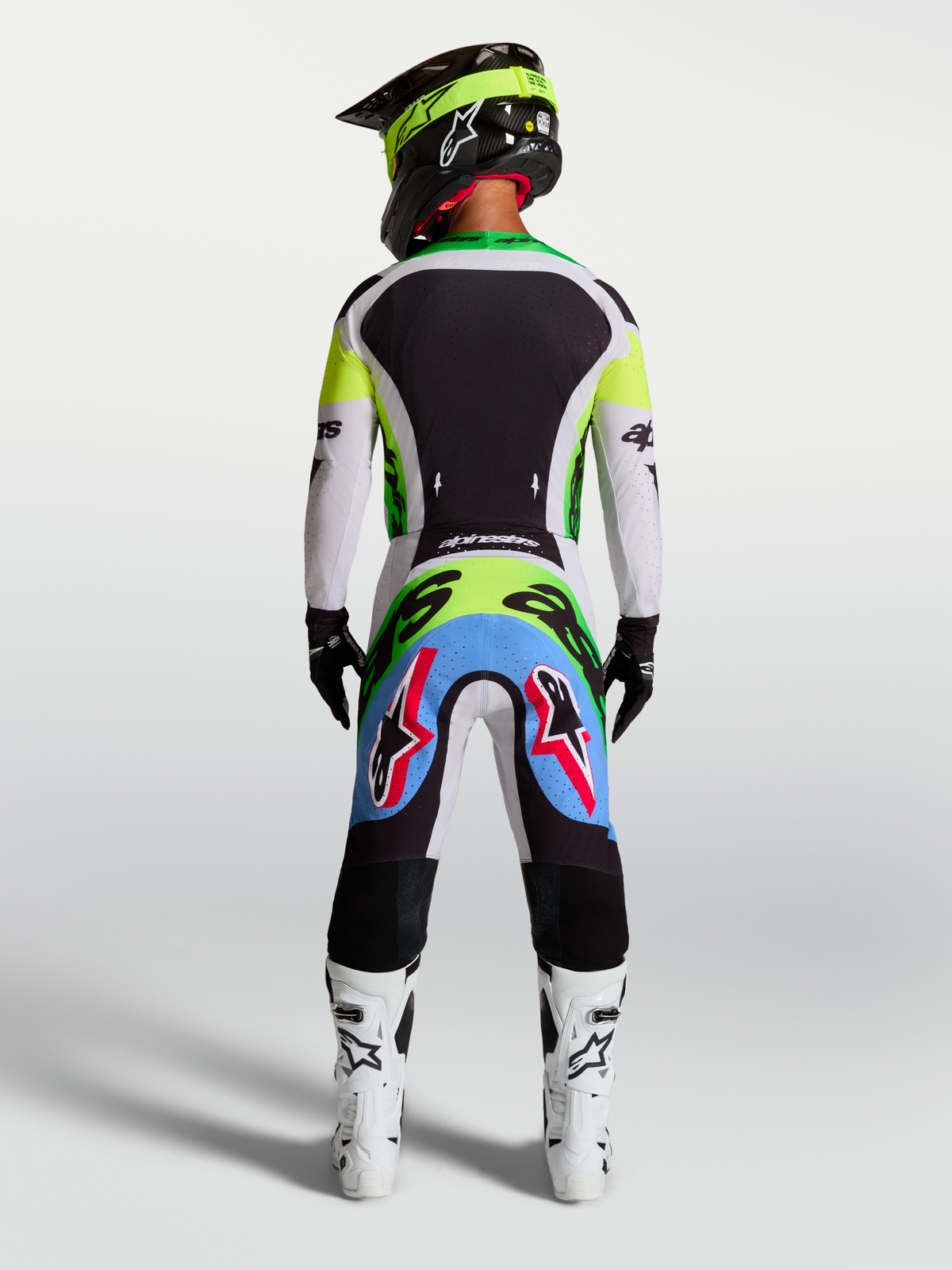 Maillot et ensemble Supertech Dyna 2027 Alpinestars, vert fluo et noir, tenue motocross homme, vue de dos, mesh extensible.