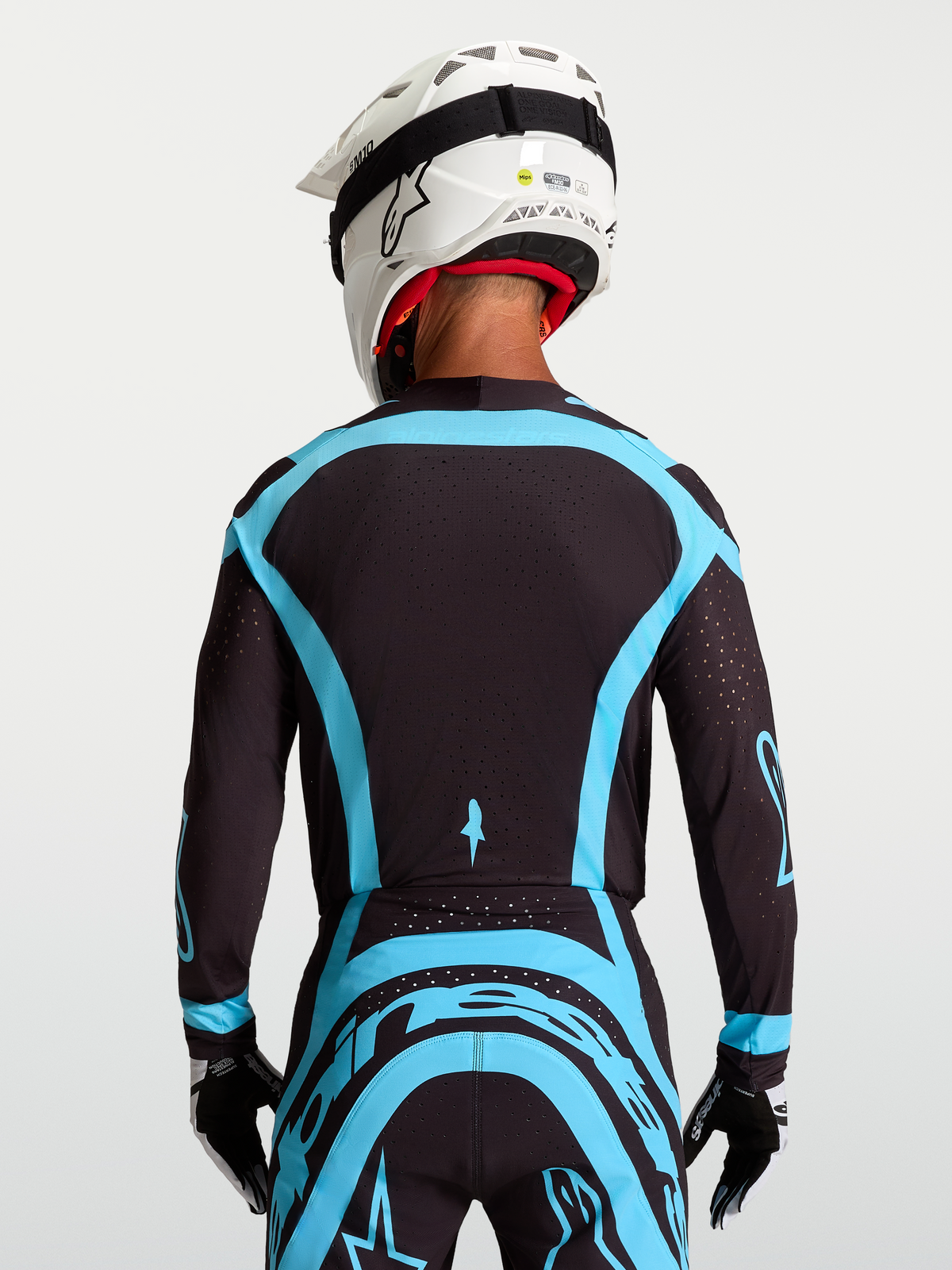Alpinestars Supertech Vesta Jersey, black and turquoise pro-level motocross racing jersey with stretch mesh.