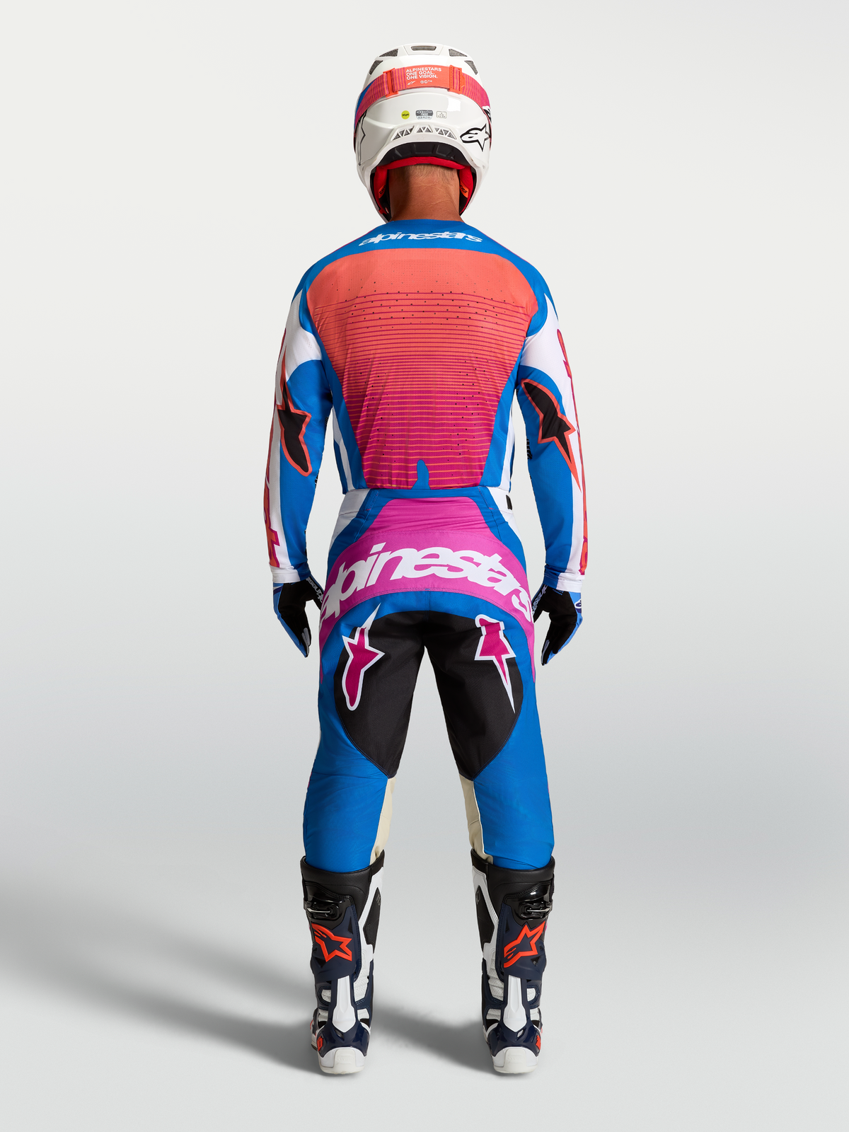 Maillot et ensemble Alpinestars Techstar Maven, équipement de motocross pour homme, bleu et corail vif, vue de dos.