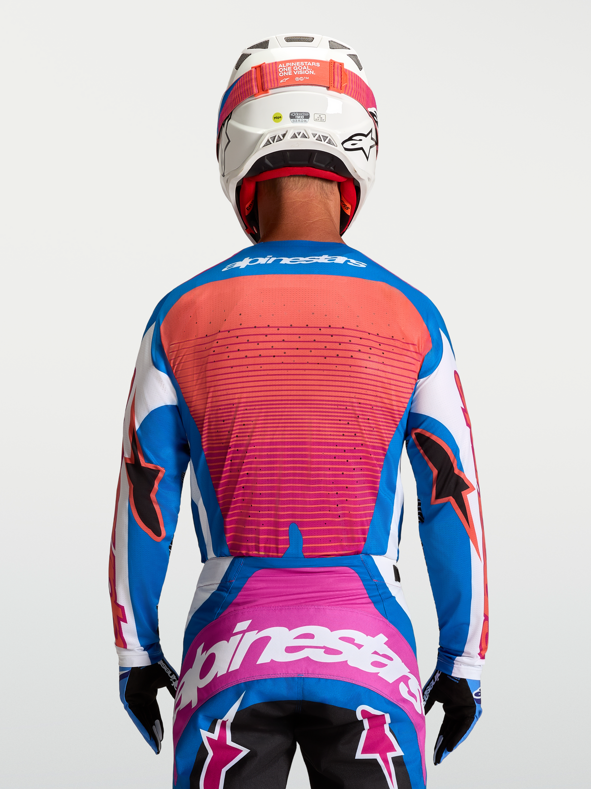 Alpinestars Maillot Techstar Maven, maillot de motocross bleu et corail pour homme, vue de dos, coupe athlétique ventilée.
