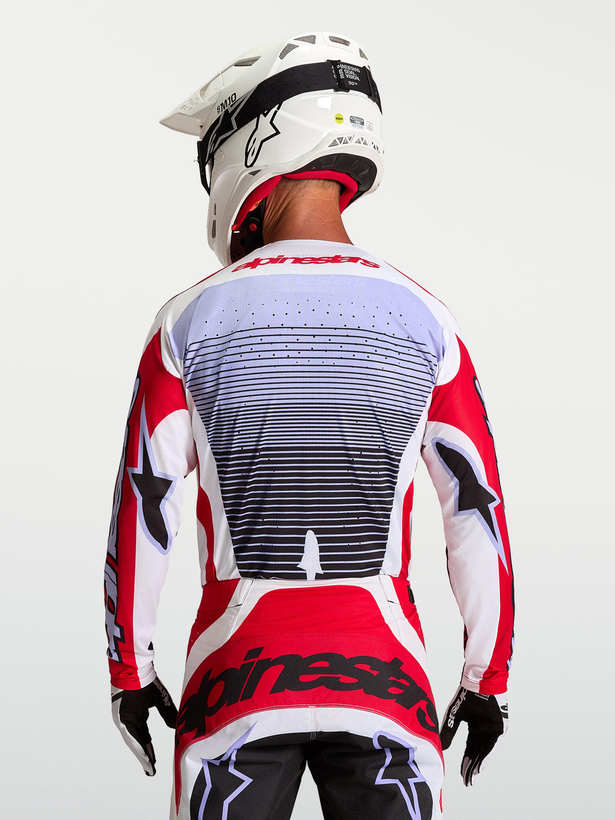Maillot Techstar Maven Alpinestars, maillot de motocross racing homme, rouge et blanc, textile respirant, vue de dos.