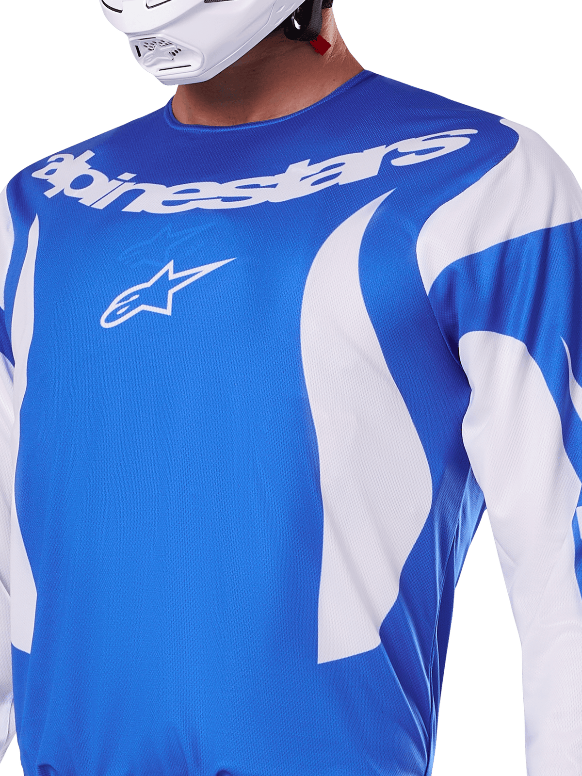 Alpinestars 2025 Fluid Haul Trikot, Blau und Weiß, getragen von einem Fahrer mit weißem Helm, mit weißem Alpinestars-Schriftzug und A-Star-Logo, sportliche Passform, leichtes feuchtigkeitsableitendes Material für Motocross und Offroad-Fahrten