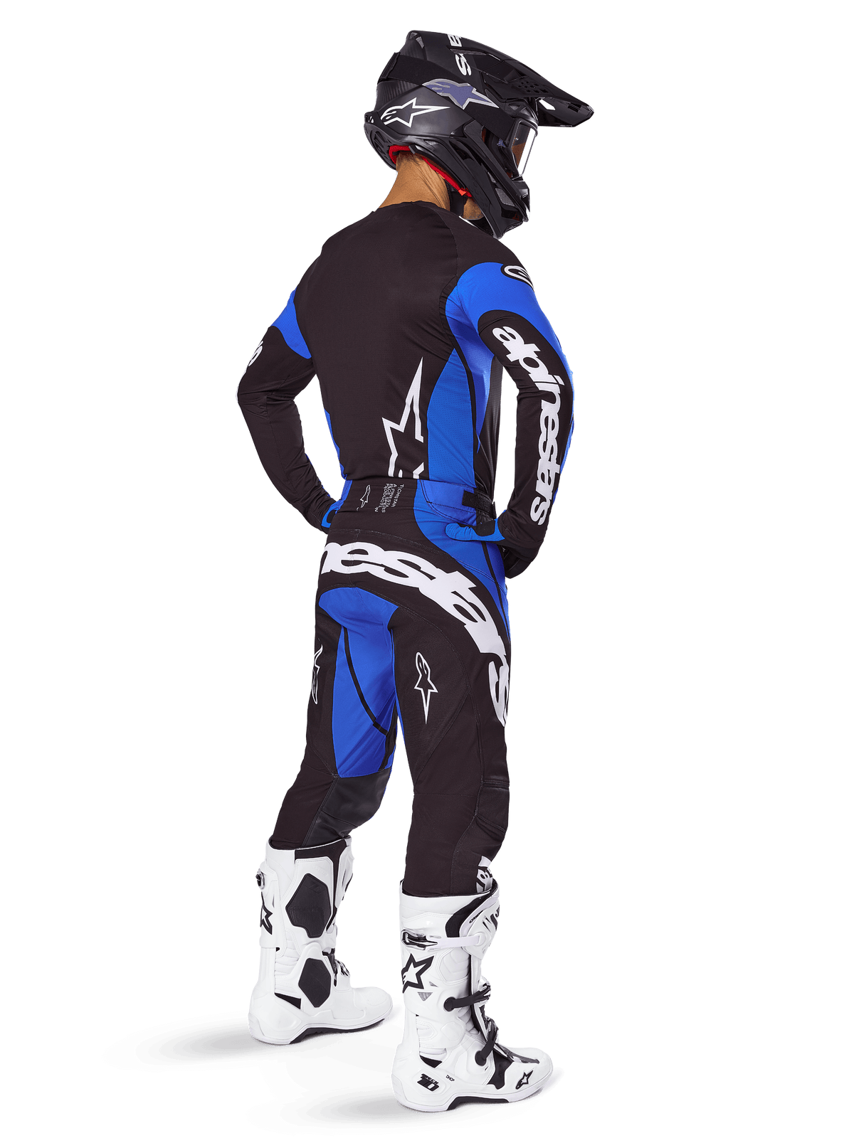 Alpinestars Techstar Dreem kledingset, zwart-blauwe motocrossuitrusting voor heren, achteraanzicht met witte motorlaarzen.